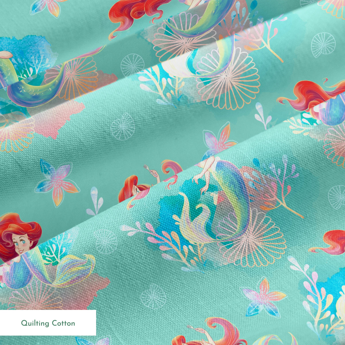 Whimsical teal pattern featuring mermaids with red hair, seashells, starfish, and coral in pastel colors springs quiltingcotton texture