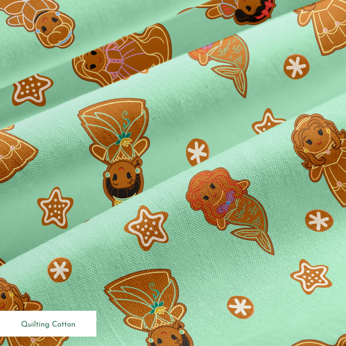 Disney Princess gingerbread cookies with star and snowflake designs on mint green background springs quiltingcotton texture