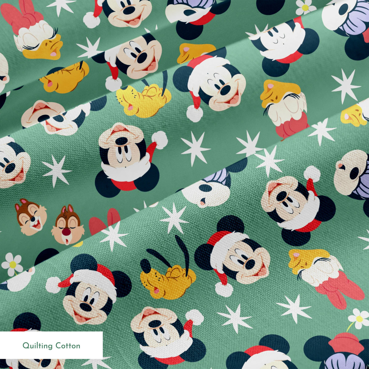 Mickey Mouse holiday pattern with characters wearing Santa hats on green background with stars and ornaments springs quiltingcotton texture