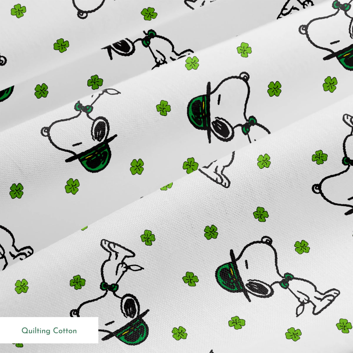 Cartoon Snoopy wearing green hat with shamrocks scattered across white background springs quiltingcotton texture