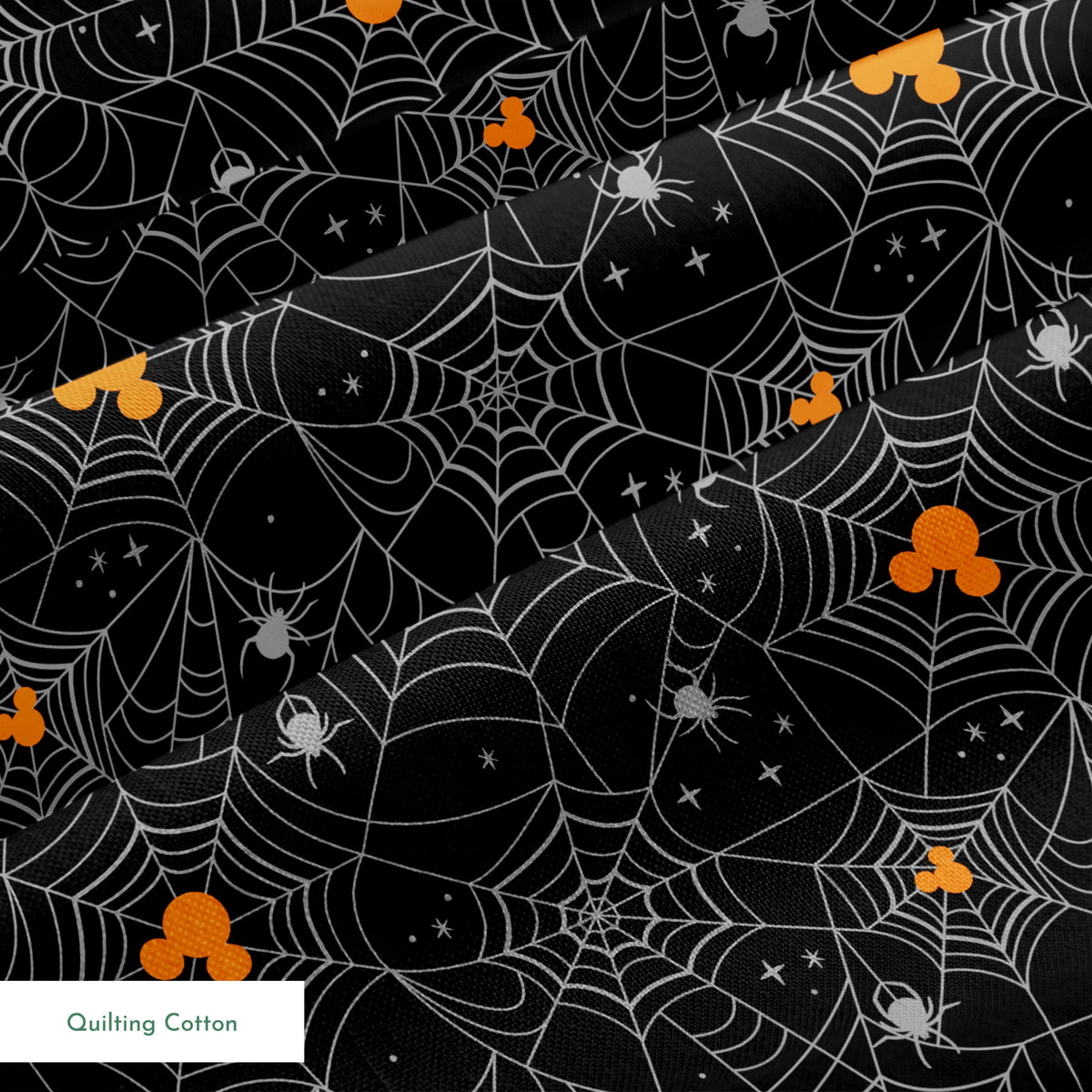Spooky Halloween pattern with white spiderwebs, orange Mickey Mouse heads, and gray spiders on black background springs quiltingcotton texture