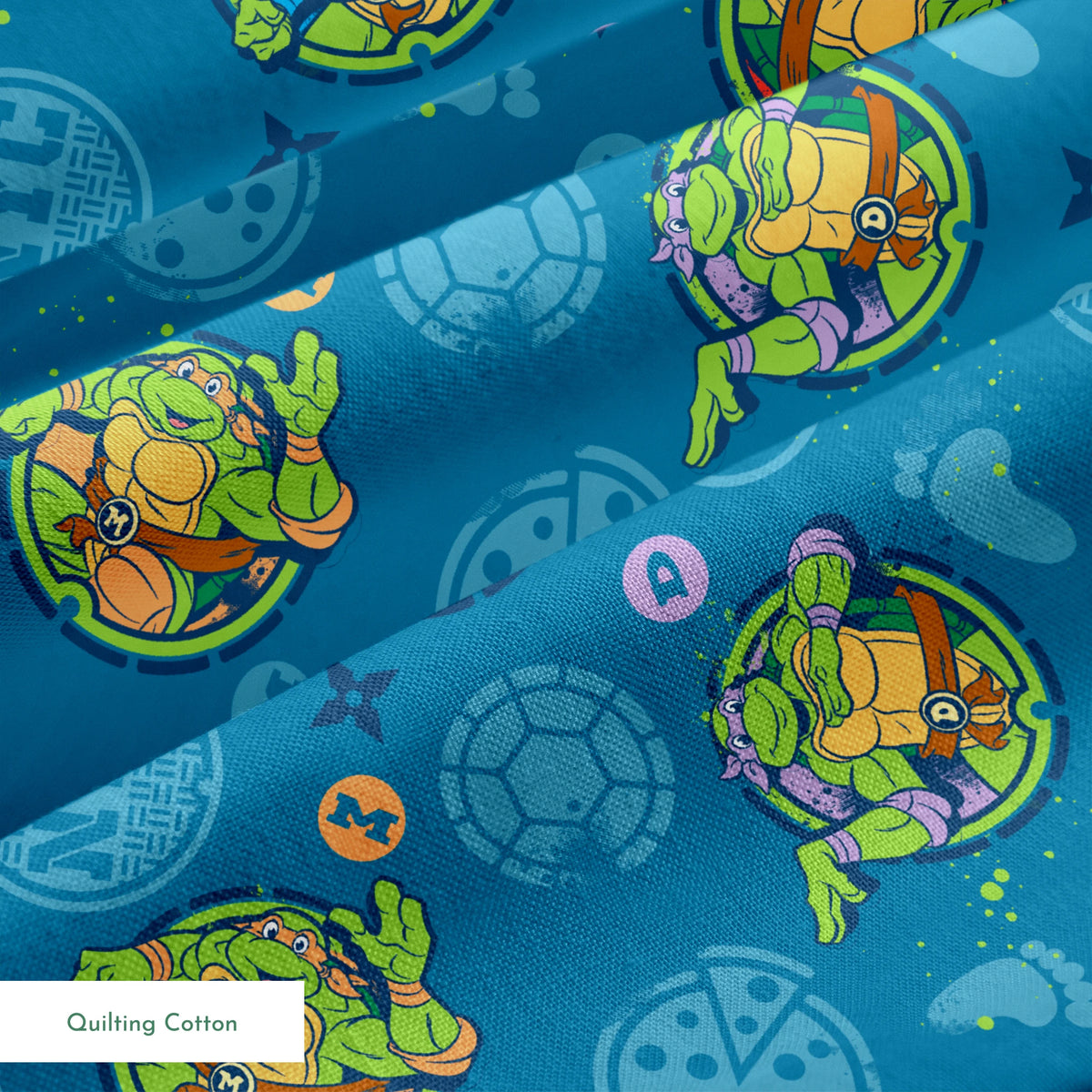 Teenage Mutant Ninja Turtles in circular medallions on teal background with subtle geometric patterns springs quiltingcotton texture