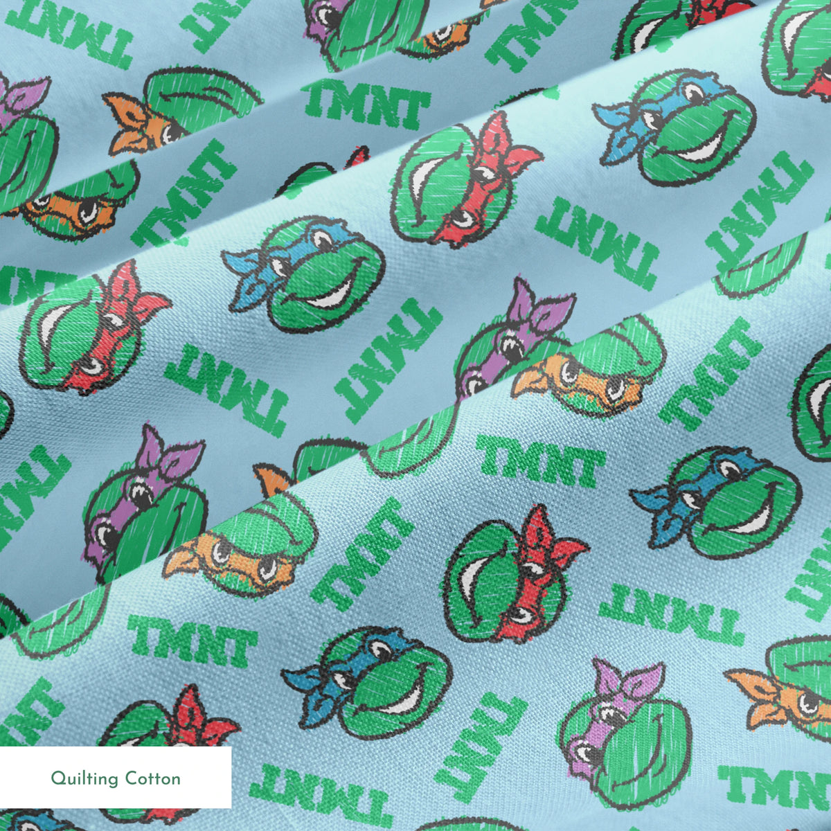 Cartoon pattern of Teenage Mutant Ninja Turtles faces with colored masks on light blue background springs quiltingcotton texture