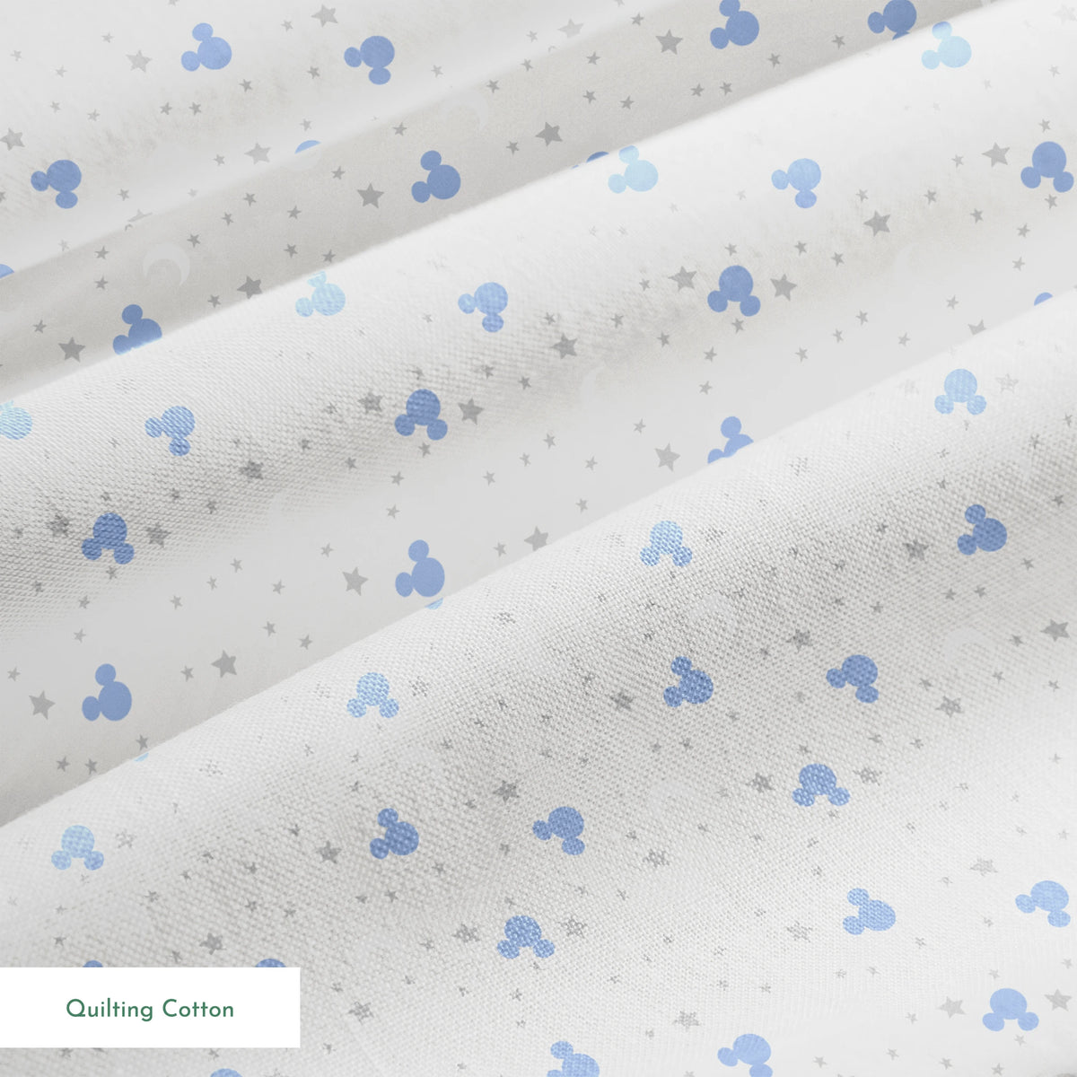 Blue Mickey Mouse silhouettes with white moons and gray stars on light gray background springs quiltingcotton texture