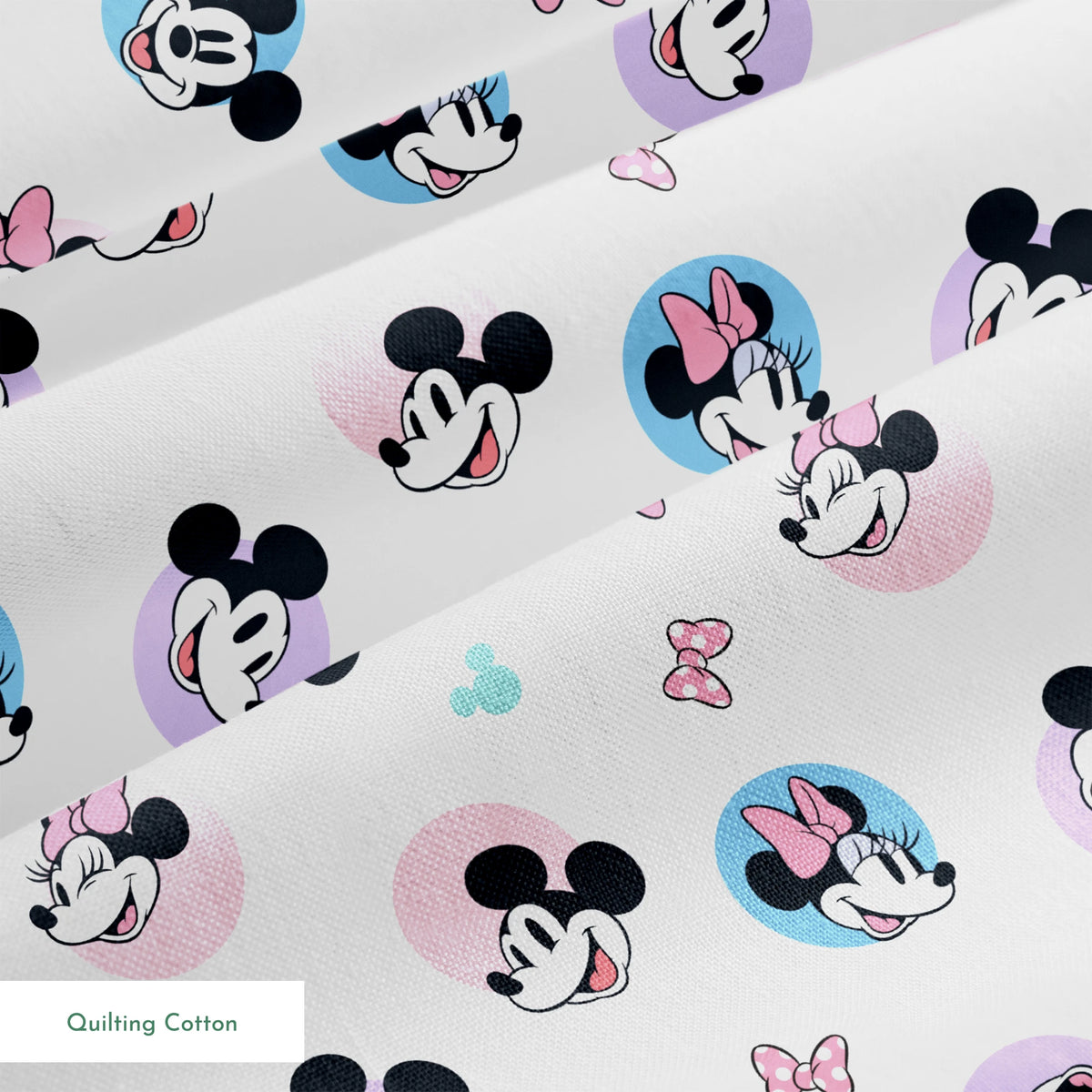 Disney Mickey and Minnie Mouse pattern with character heads on pastel circles, pink bows, and small Mickey icons springs quiltingcotton texture