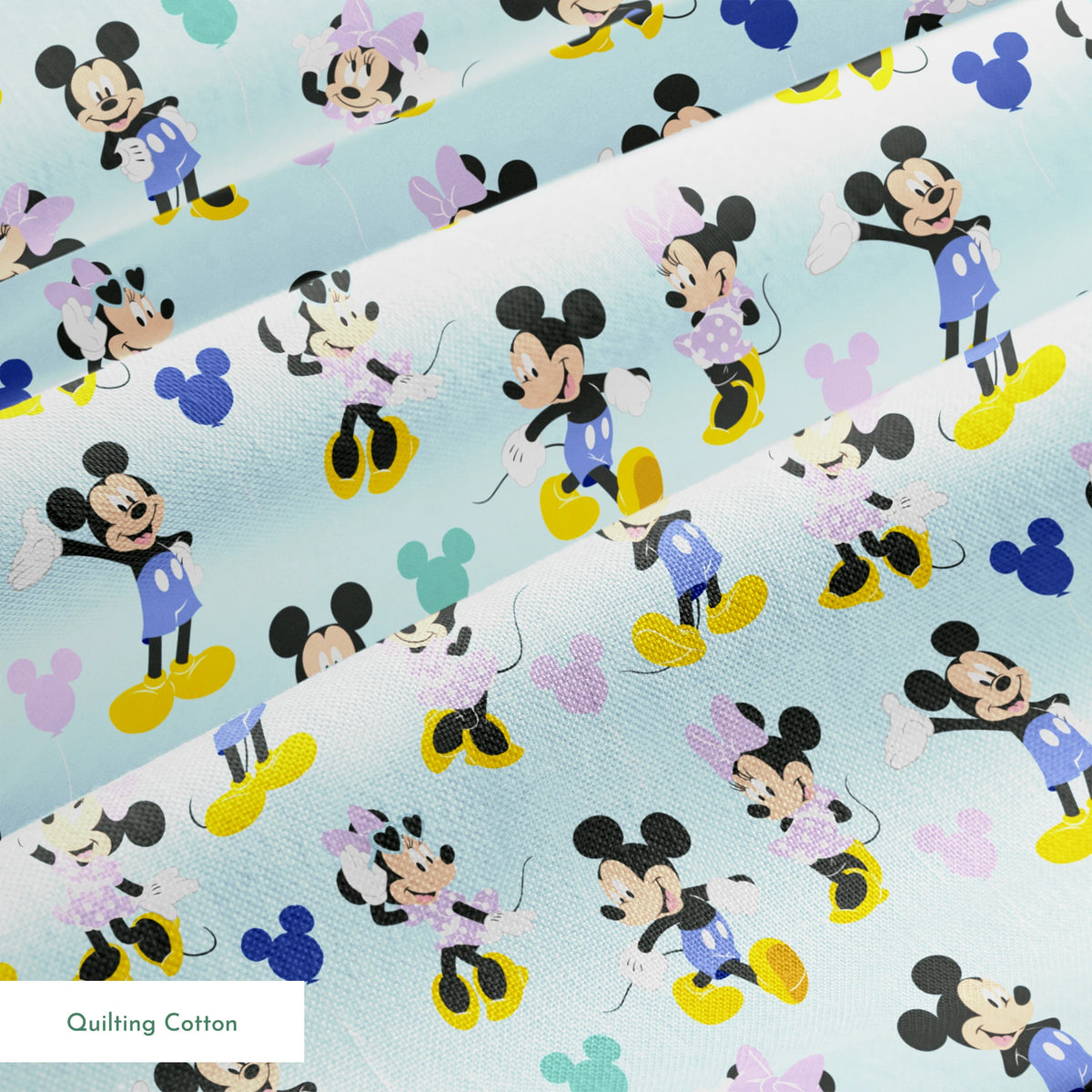 Pattern of Mickey and Minnie Mouse characters in various poses on light blue background springs quiltingcotton texture