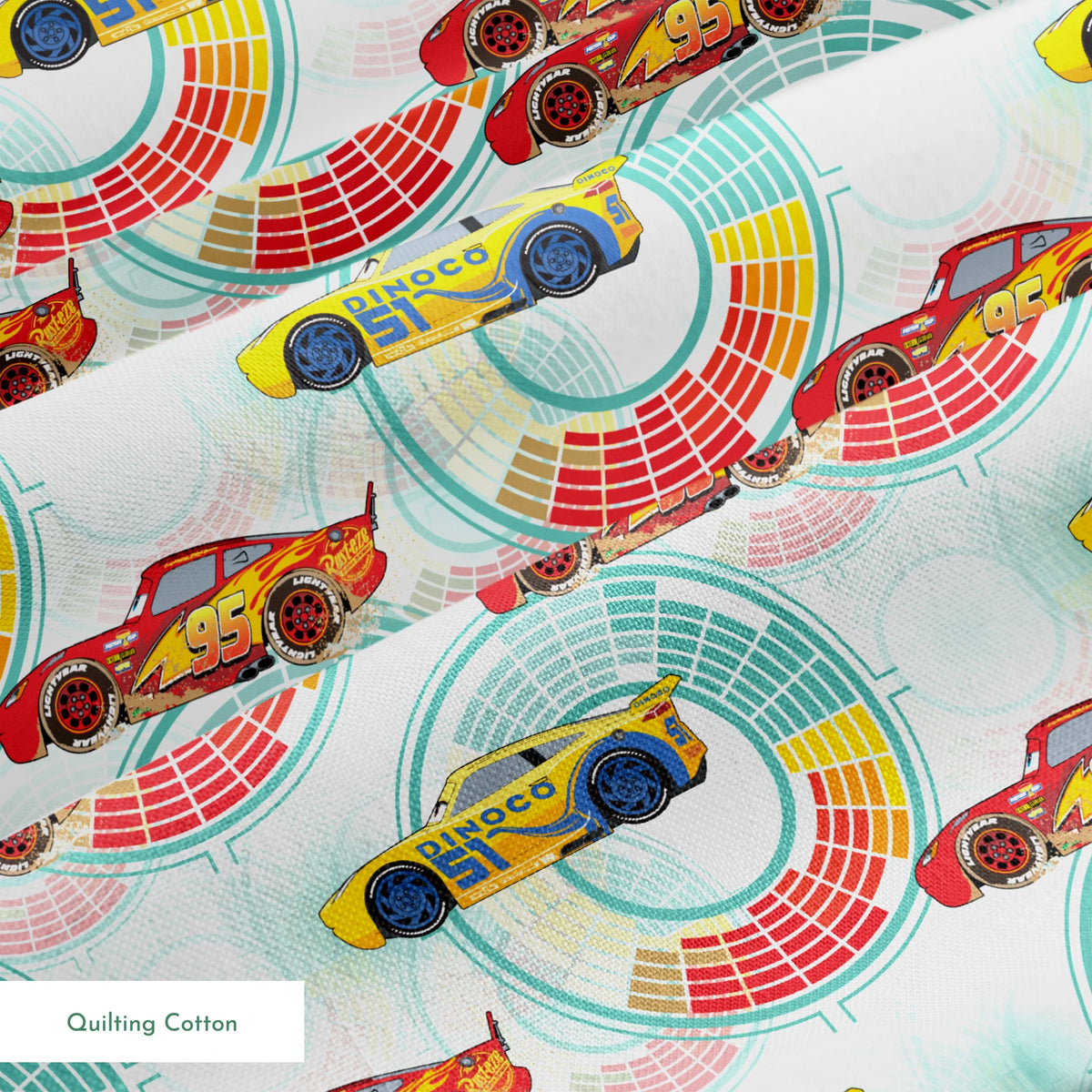 Colorful Disney Pixar Cars racing in red and yellow on a light blue background with circular patterns springs quiltingcotton texture