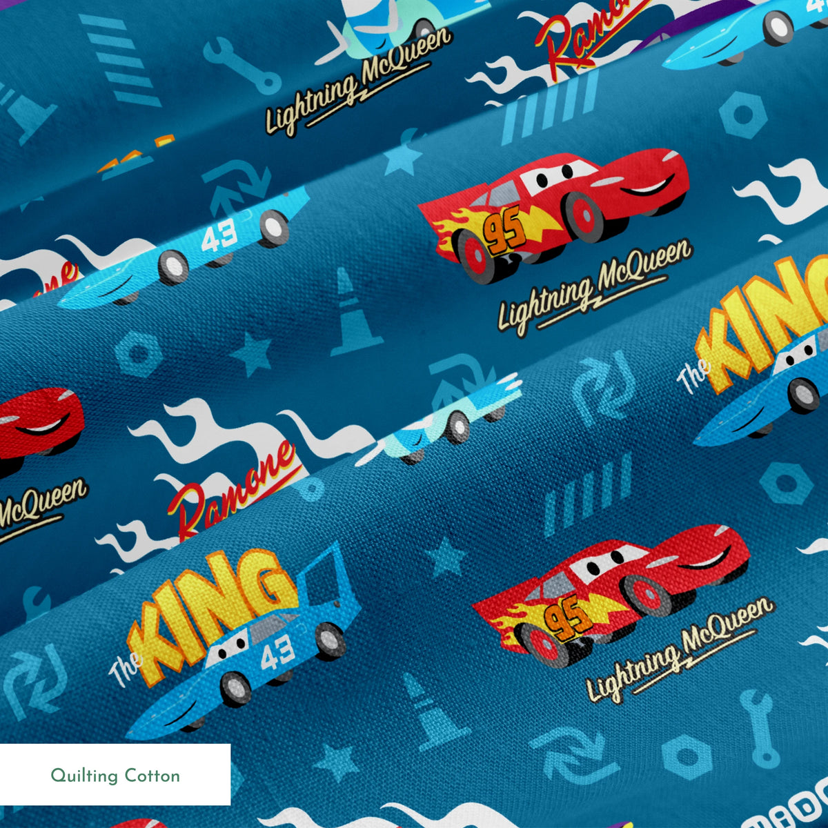 Disney Cars pattern featuring Lightning McQueen, Ramone's purple car with flames, and The King 43 on blue background with racing icons springs quiltingcotton texture