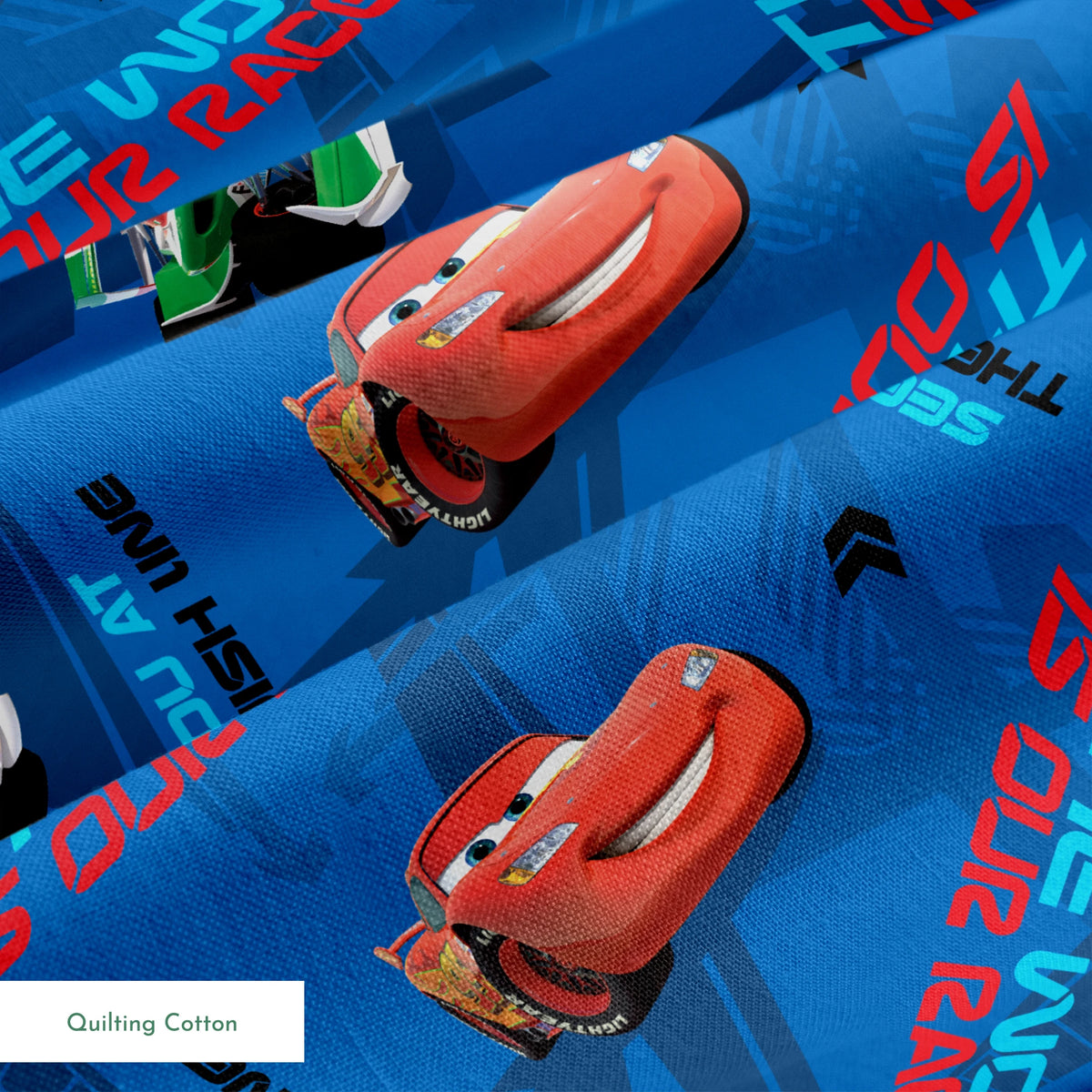 Blue fabric pattern with animated red race cars, "The World of Cars" text, and directional arrow designs springs quiltingcotton texture