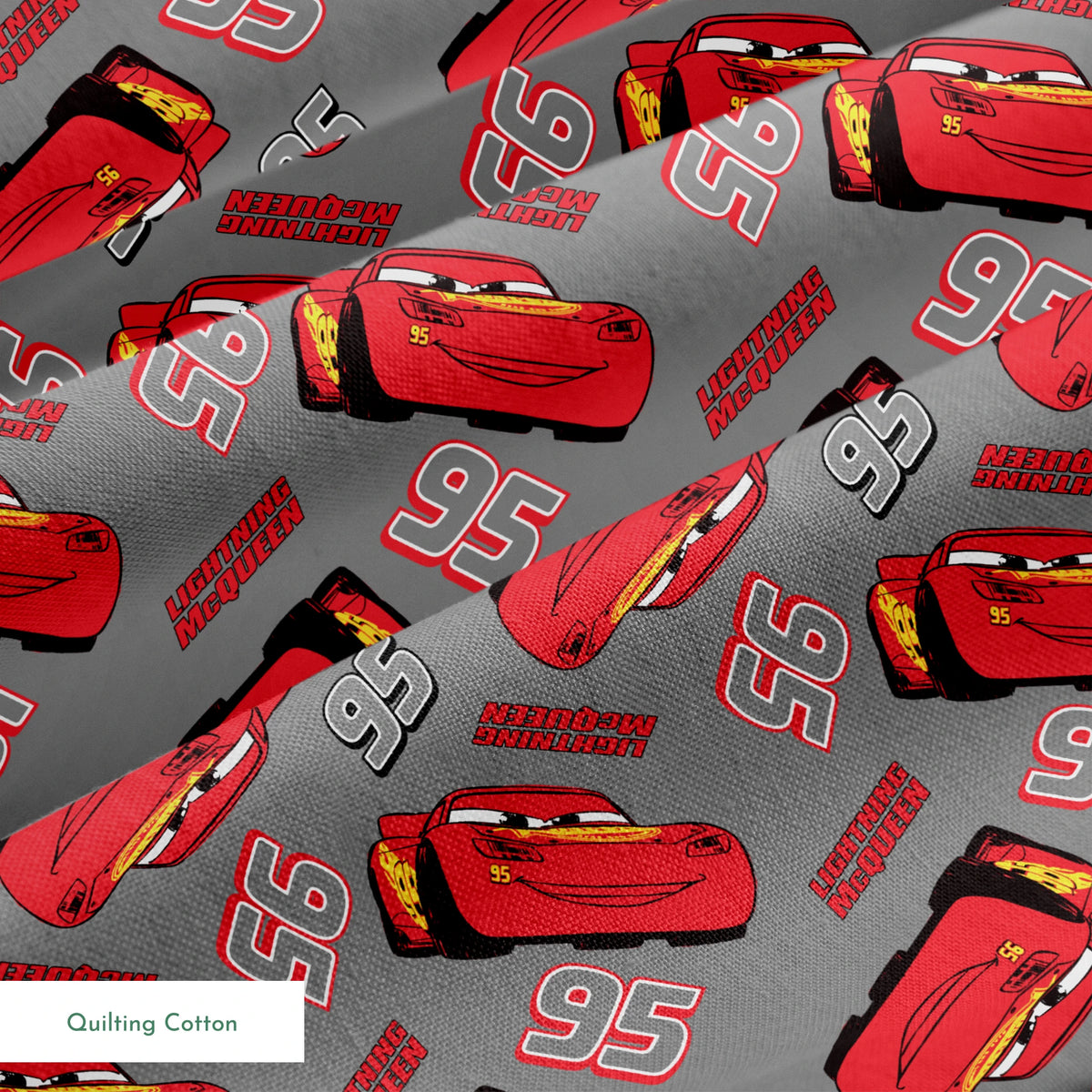Lightning McQueen pattern with red race cars and number 95 on gray background springs quiltingcotton texture