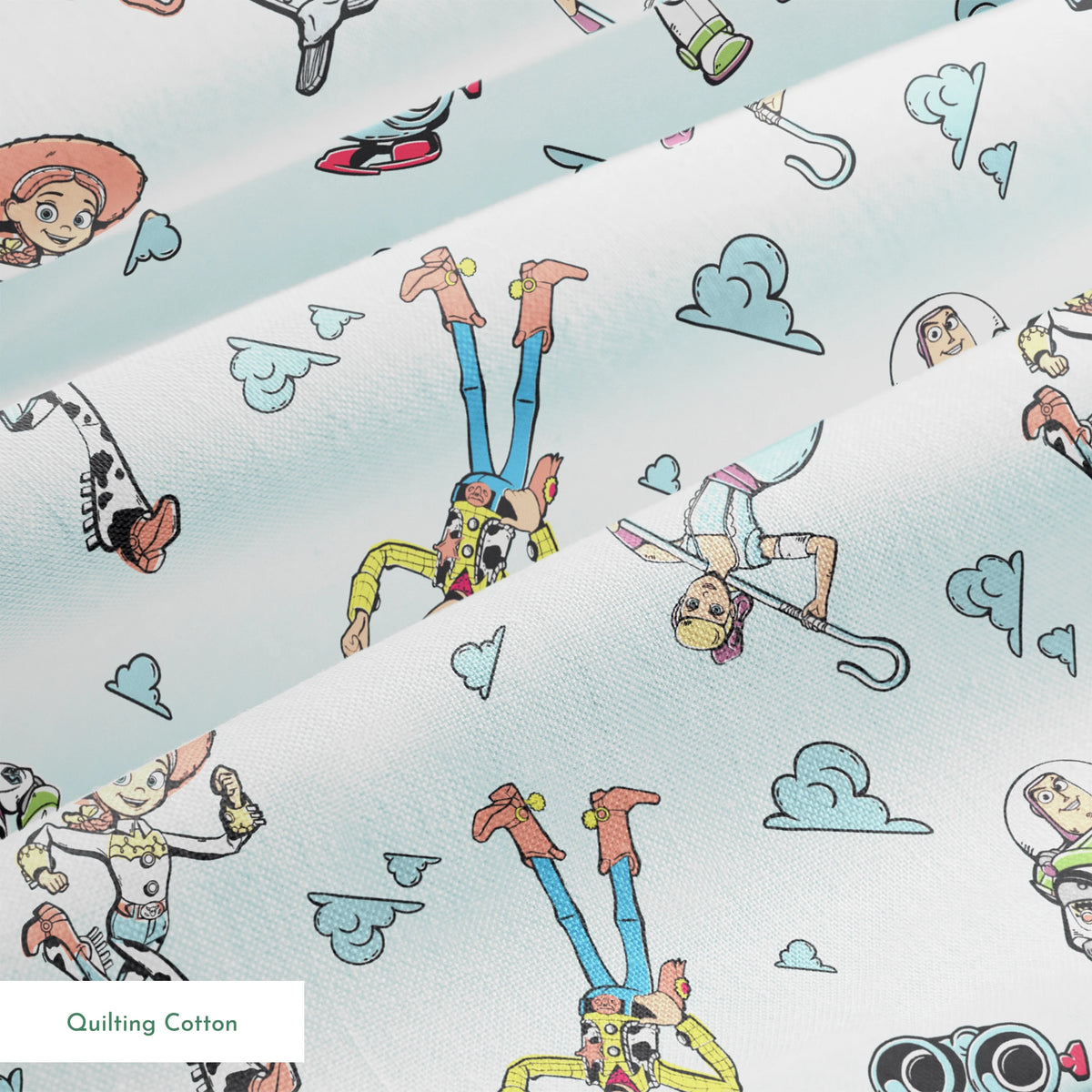 Cartoon characters from "Toy Story" floating on light blue background with cloud patterns springs quiltingcotton texture