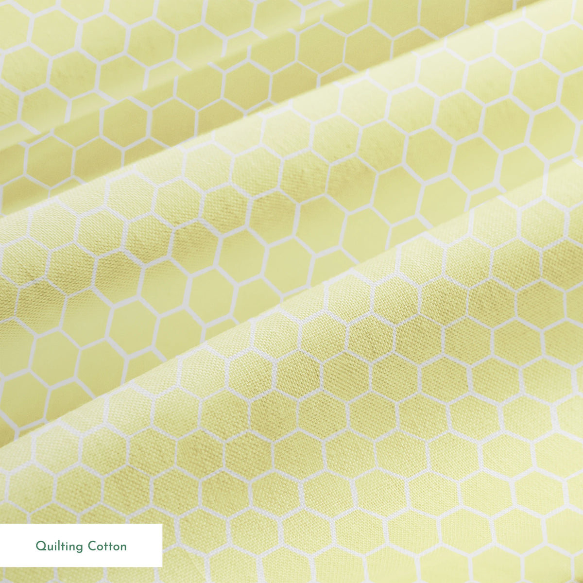 Yellow and white honeycomb pattern fabric designed by Nicole Tamarin with a soft geometric style perfect for bright, cheerful projects. springs quiltingcotton texture