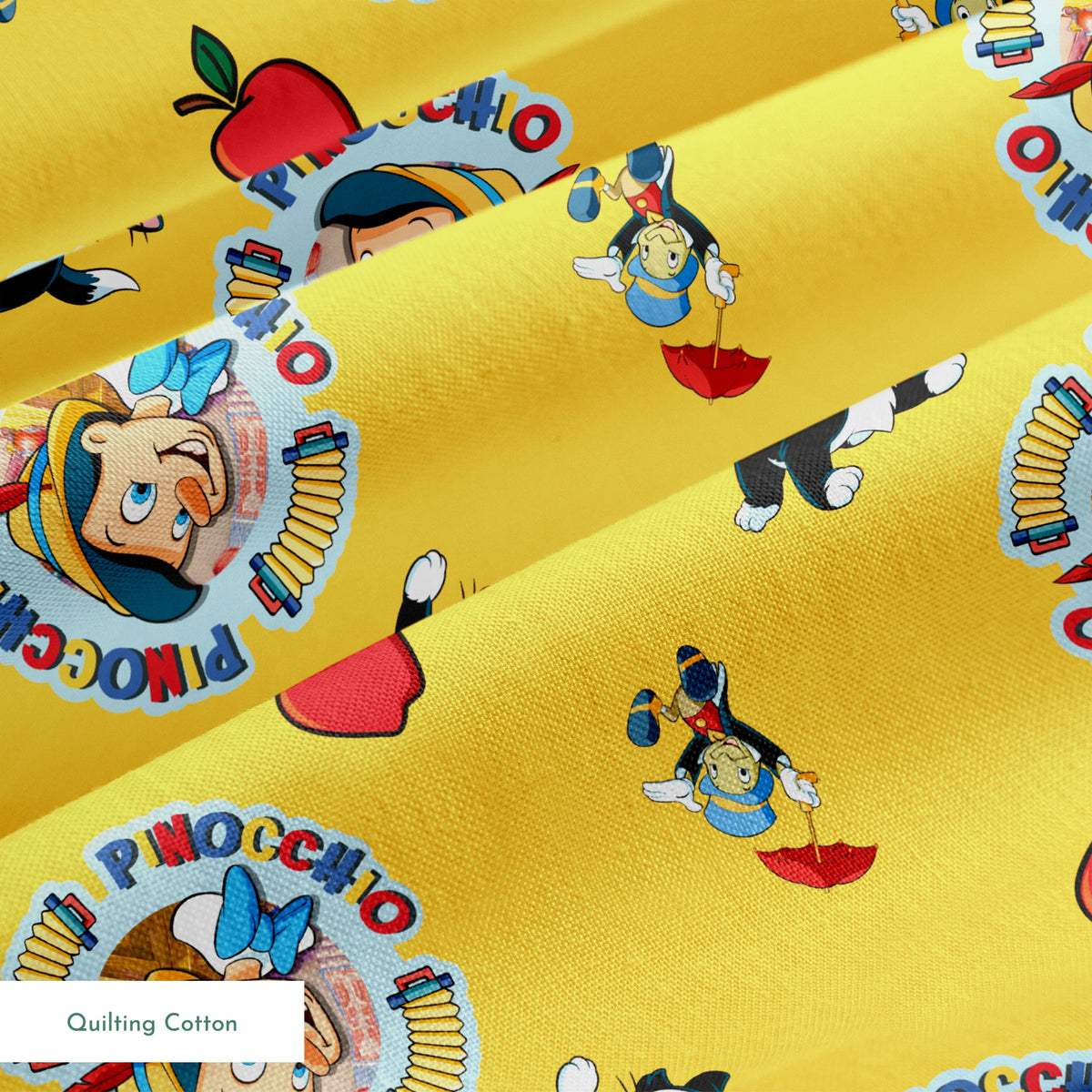 Pinocchio and Disney character pattern on yellow background with circular logos and red apples springs quiltingcotton texture