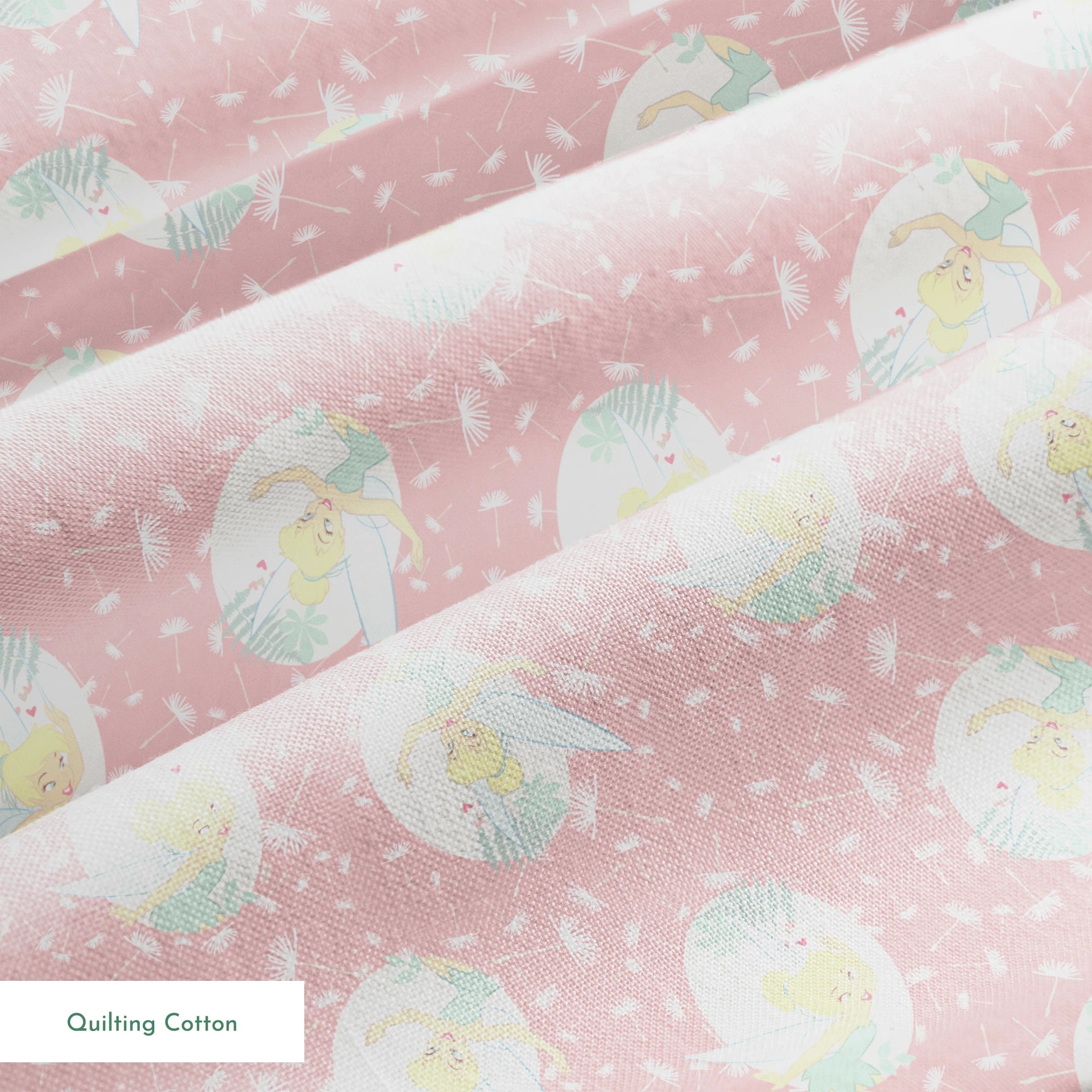 Pink background with dandelion seed pattern featuring Tinker Bell in mint green circles, whimsical Disney design springs quiltingcotton texture