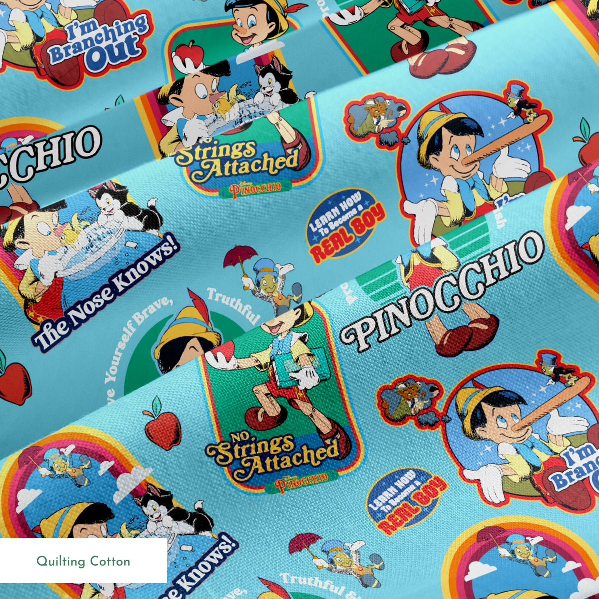 Colorful Pinocchio cartoon pattern featuring puppet characters, slogans, and red apples on teal background springs quiltingcotton texture