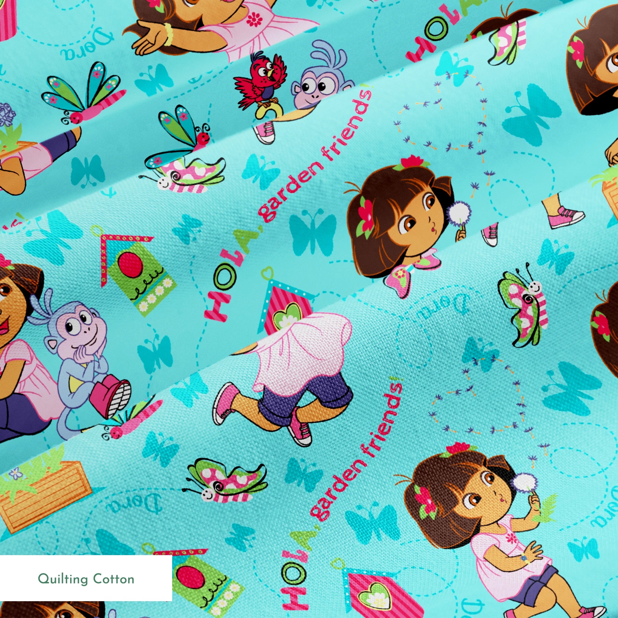 Colorful Dora the Explorer pattern on light blue background springs quiltingcotton texture
