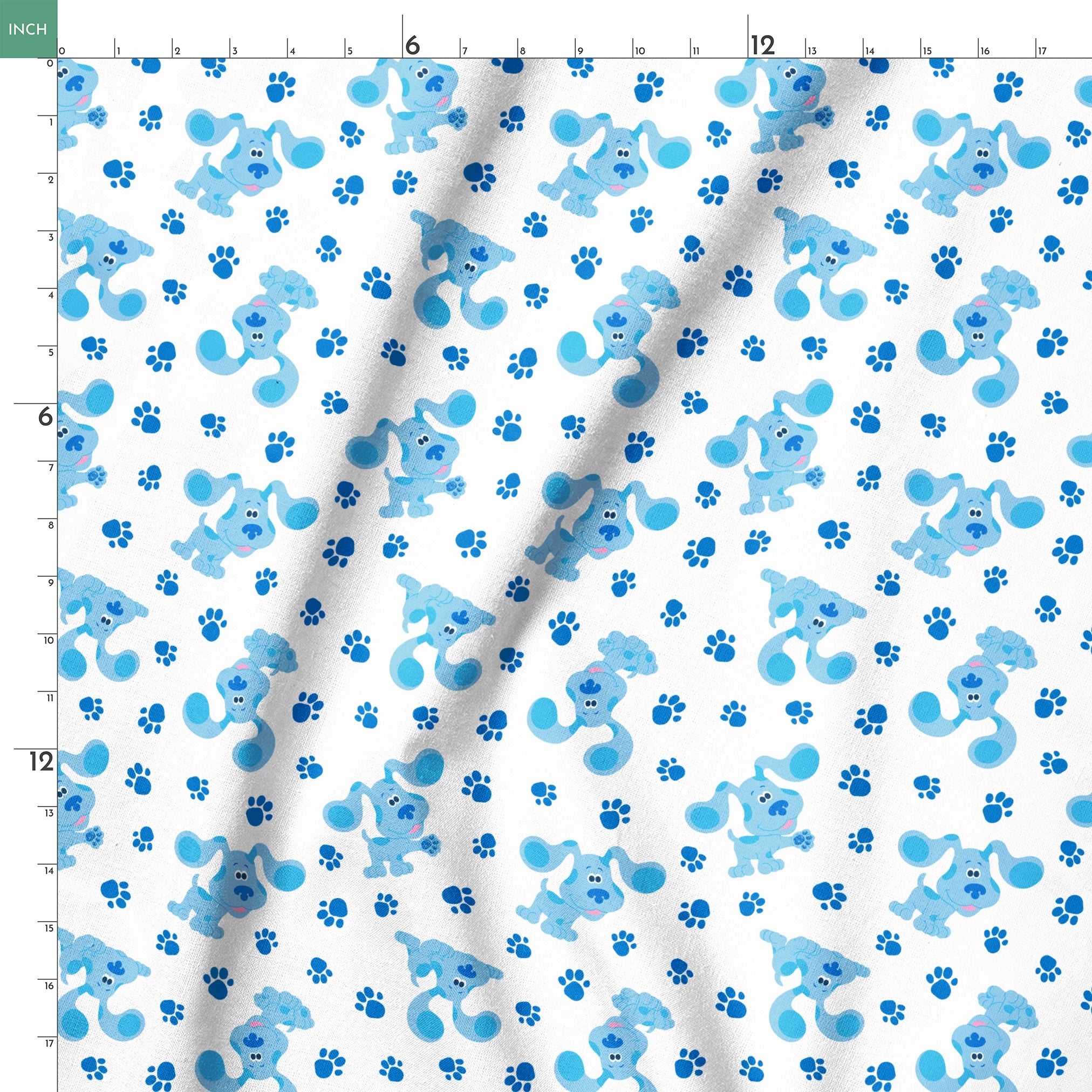 Blue cartoon puppies with floppy ears scattered among paw print pattern on white background springs ruler 18x18