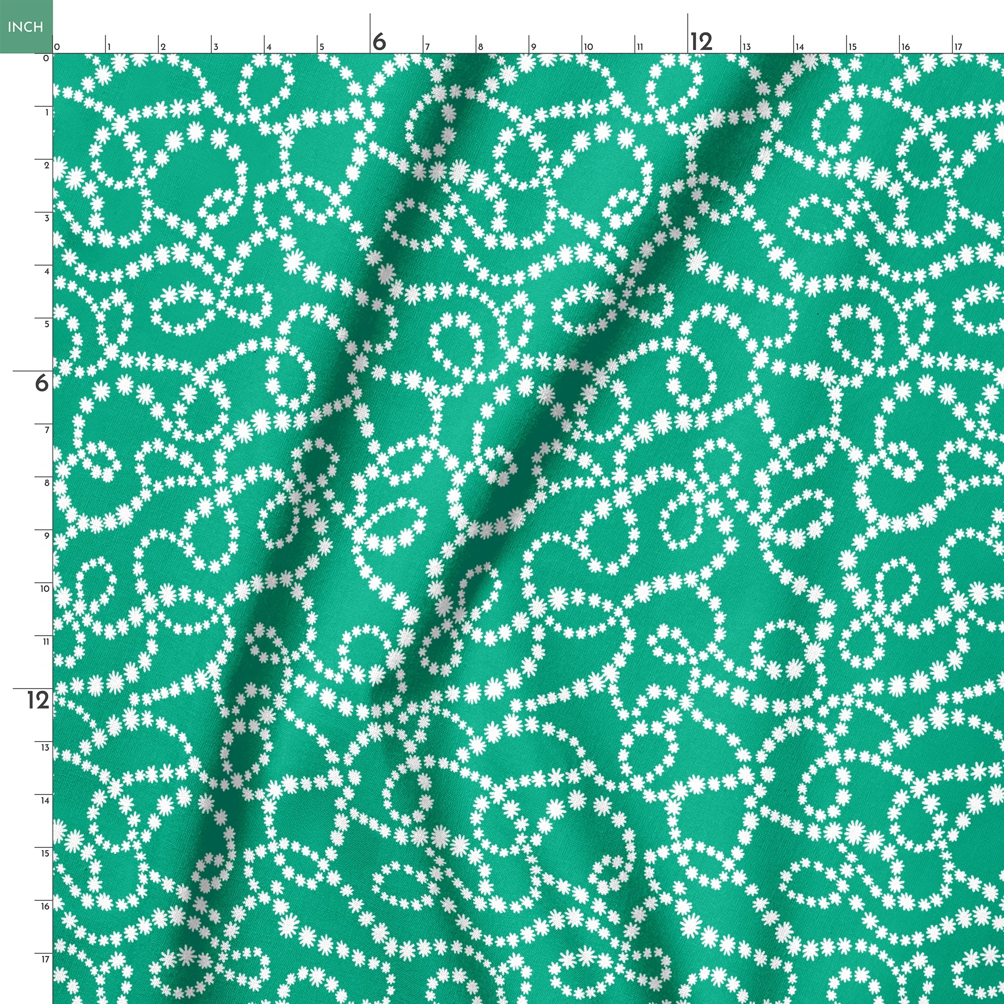White dotted swirling patterns on green background forming abstract curving lines springs ruler 18x18