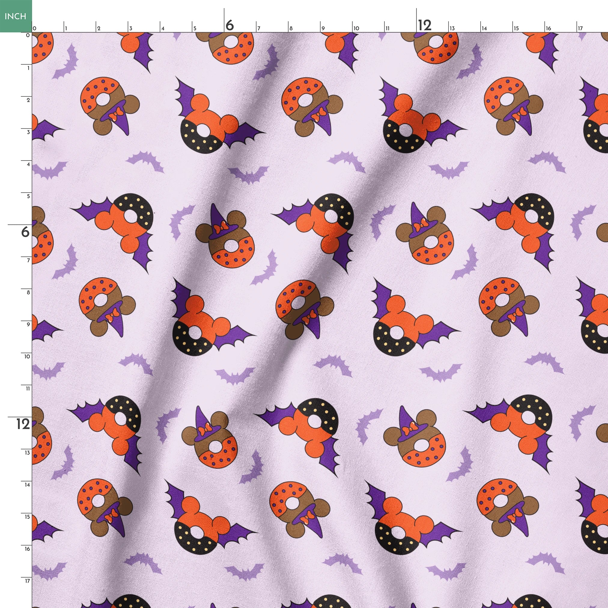 Disney Halloween-themed pattern with orange and black donuts, purple bat wings, and light purple bats on lavender background springs ruler 18x18