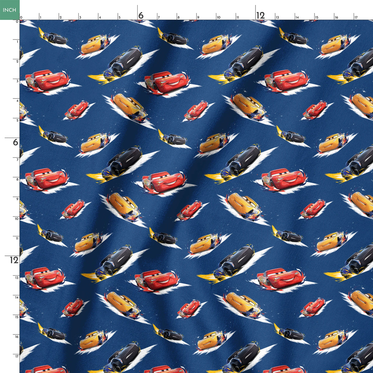 Animated race cars from Disney's Cars movie speeding across a blue background with white motion streaks springs ruler 18x18