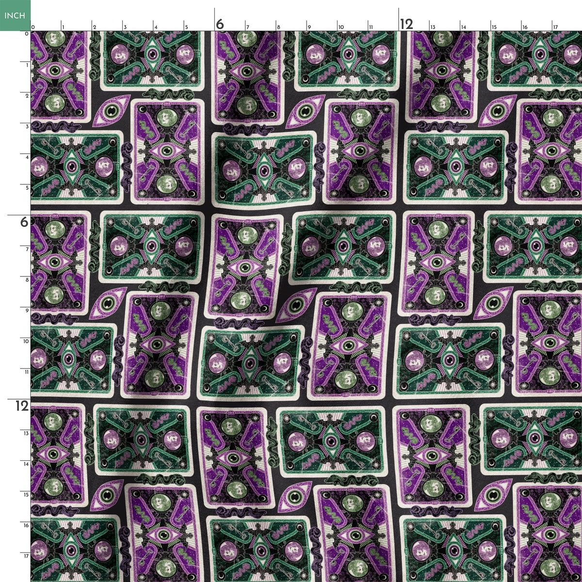 Ornate playing card designs with purple and green patterns featuring central eye motifs and circular number elements against a black background. springs ruler 18x18