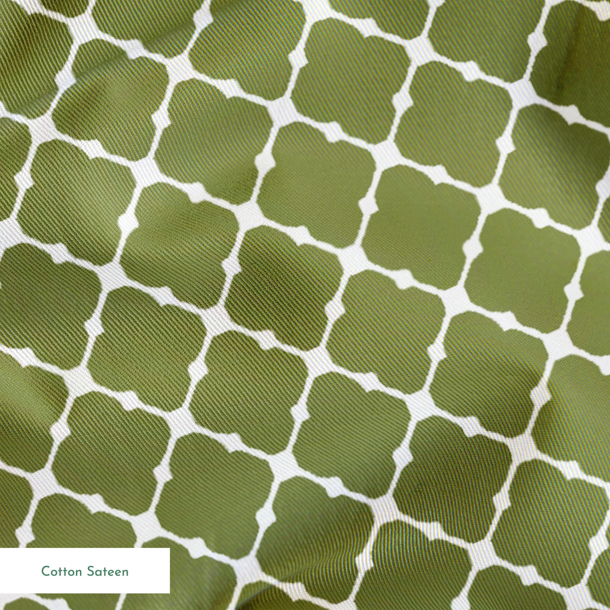 Sage green quatrefoil pattern with white lattice lines forming a Moroccan-style geometric design springs sateen texture