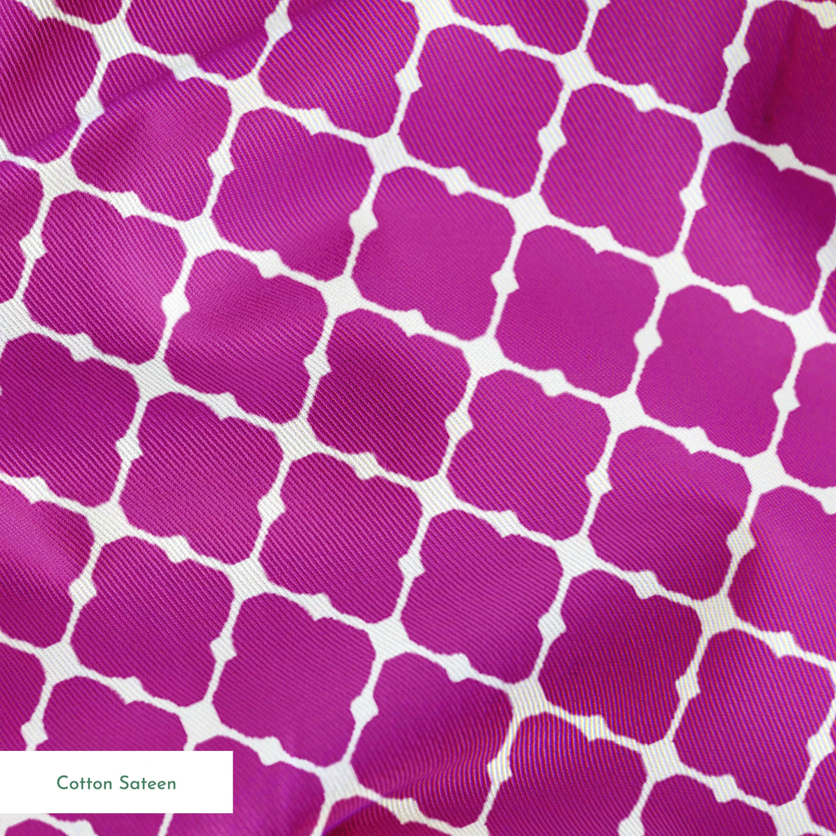 Magenta quatrefoil pattern with white lattice outline springs sateen texture