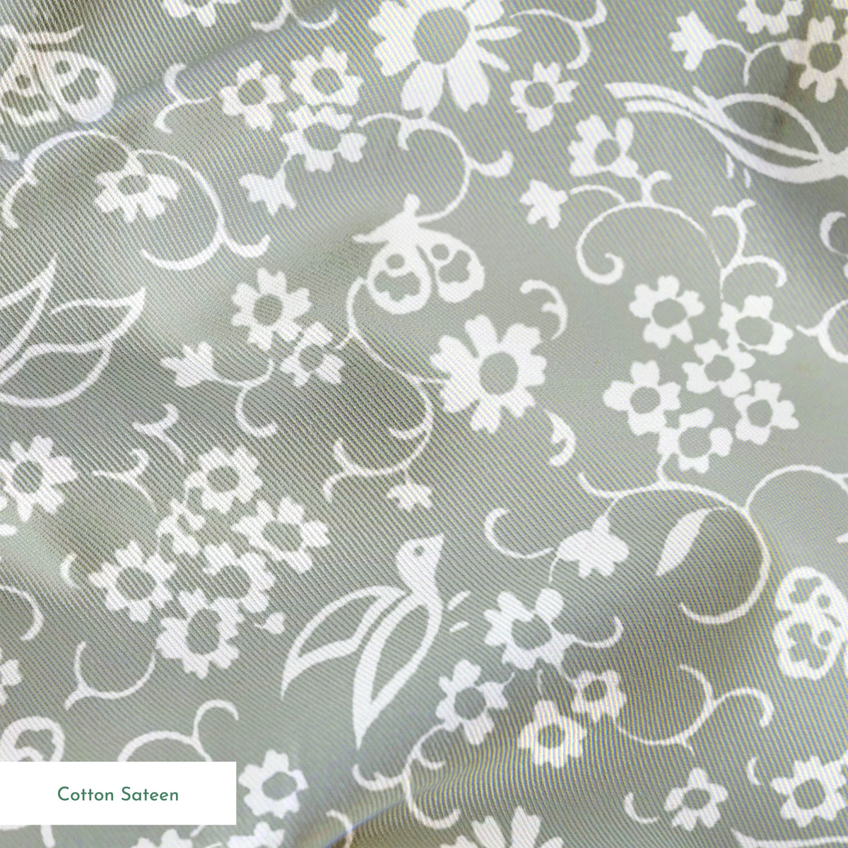 White vintage-style bird and floral silhouettes on a soft gray background. springs sateen texture