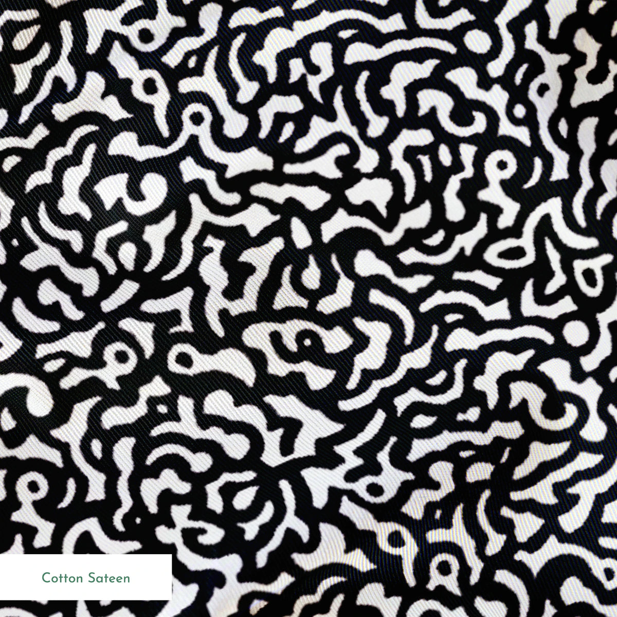Abstract black and white pattern with swirling organic lines creating a dense maze-like design springs sateen texture