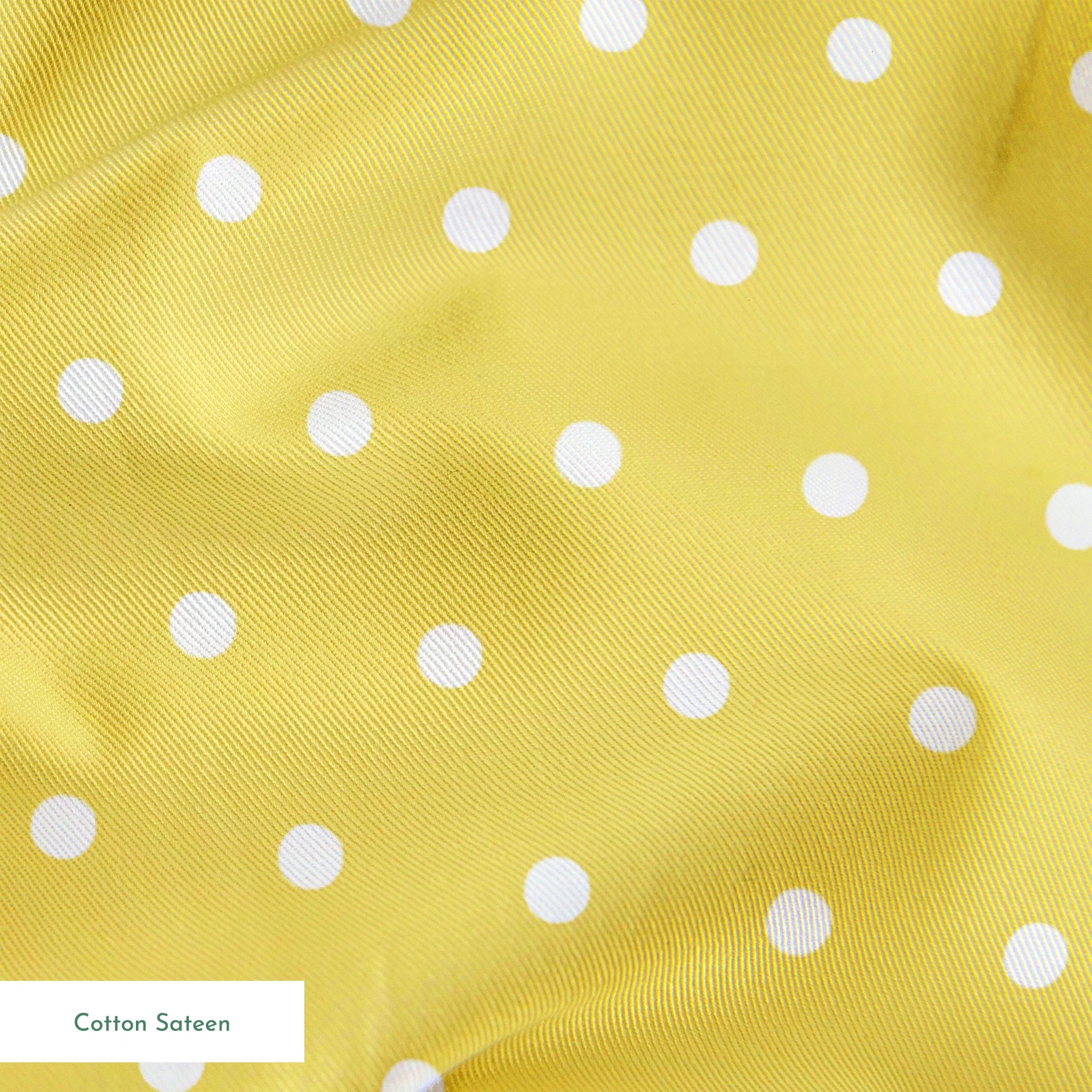 Yellow background with white circles. springs sateen texture