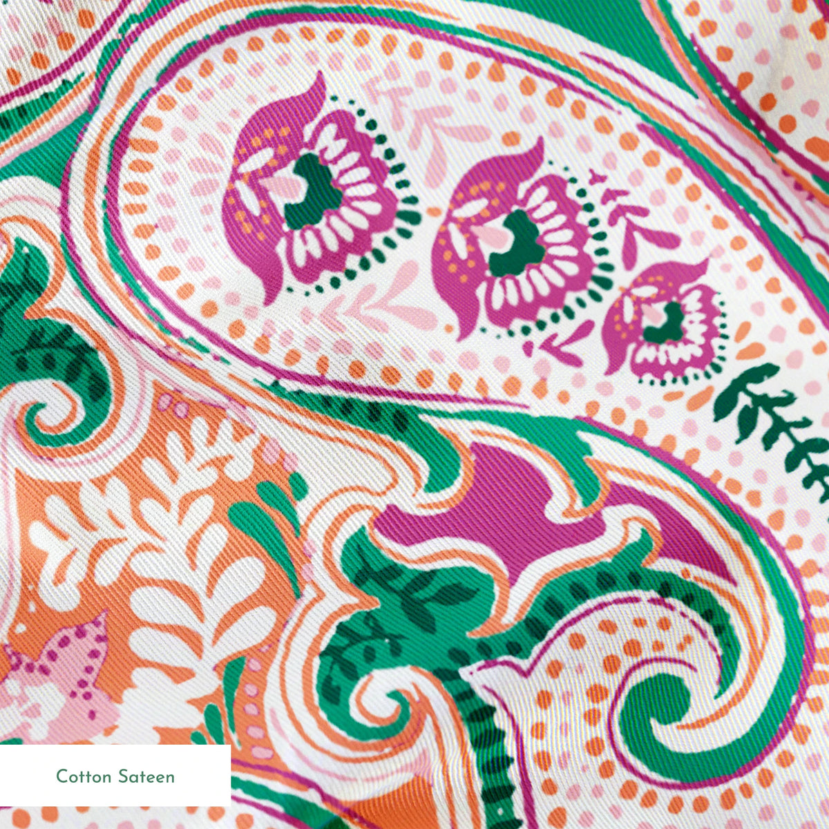 Colorful paisley pattern with swirling teardrop shapes in pink, green, and orange on light background springs sateen texture