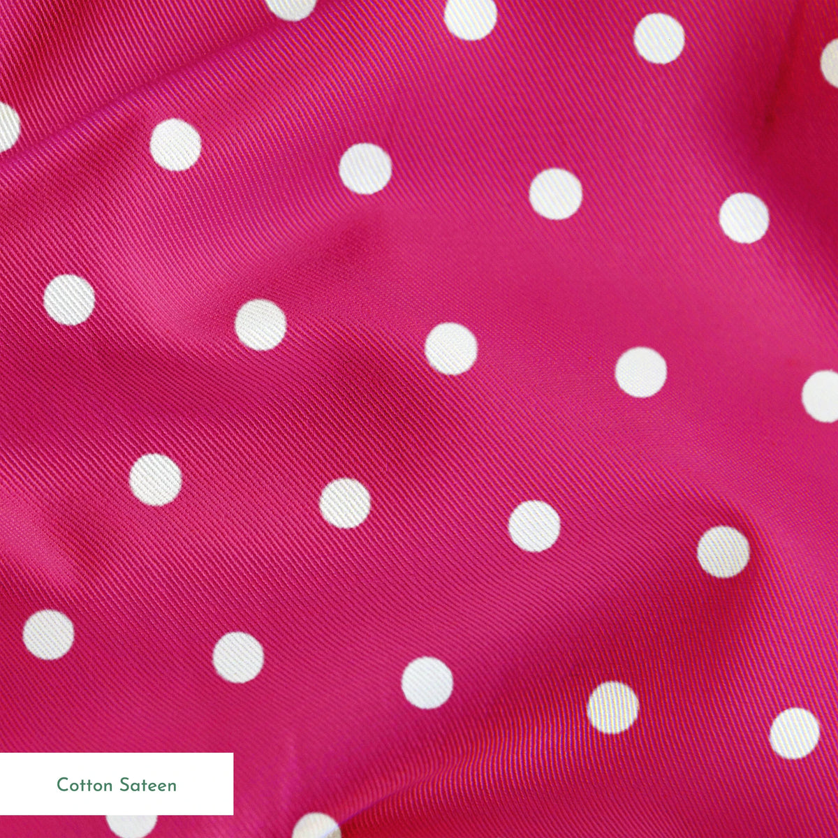 Two white circular dots on a solid magenta pink background springs sateen texture
