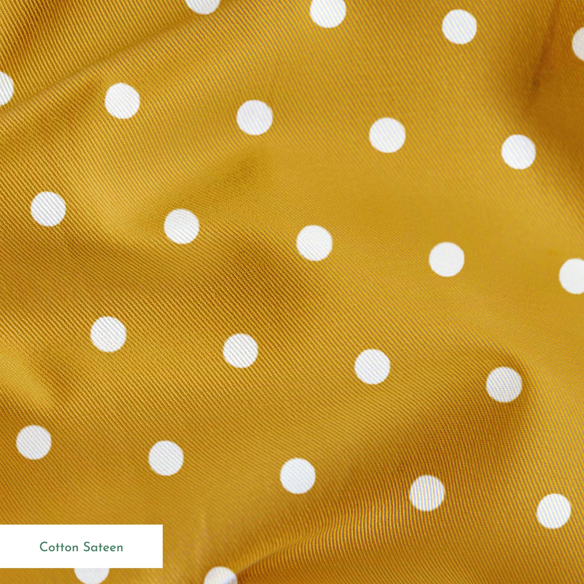 White circles on a golden yellow background springs sateen texture