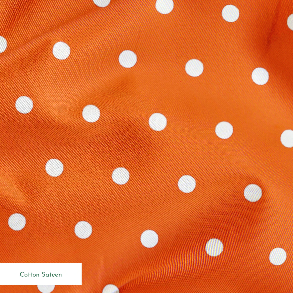 Orange background with two white circles, one in the upper left corner and another in the middle right. springs sateen texture