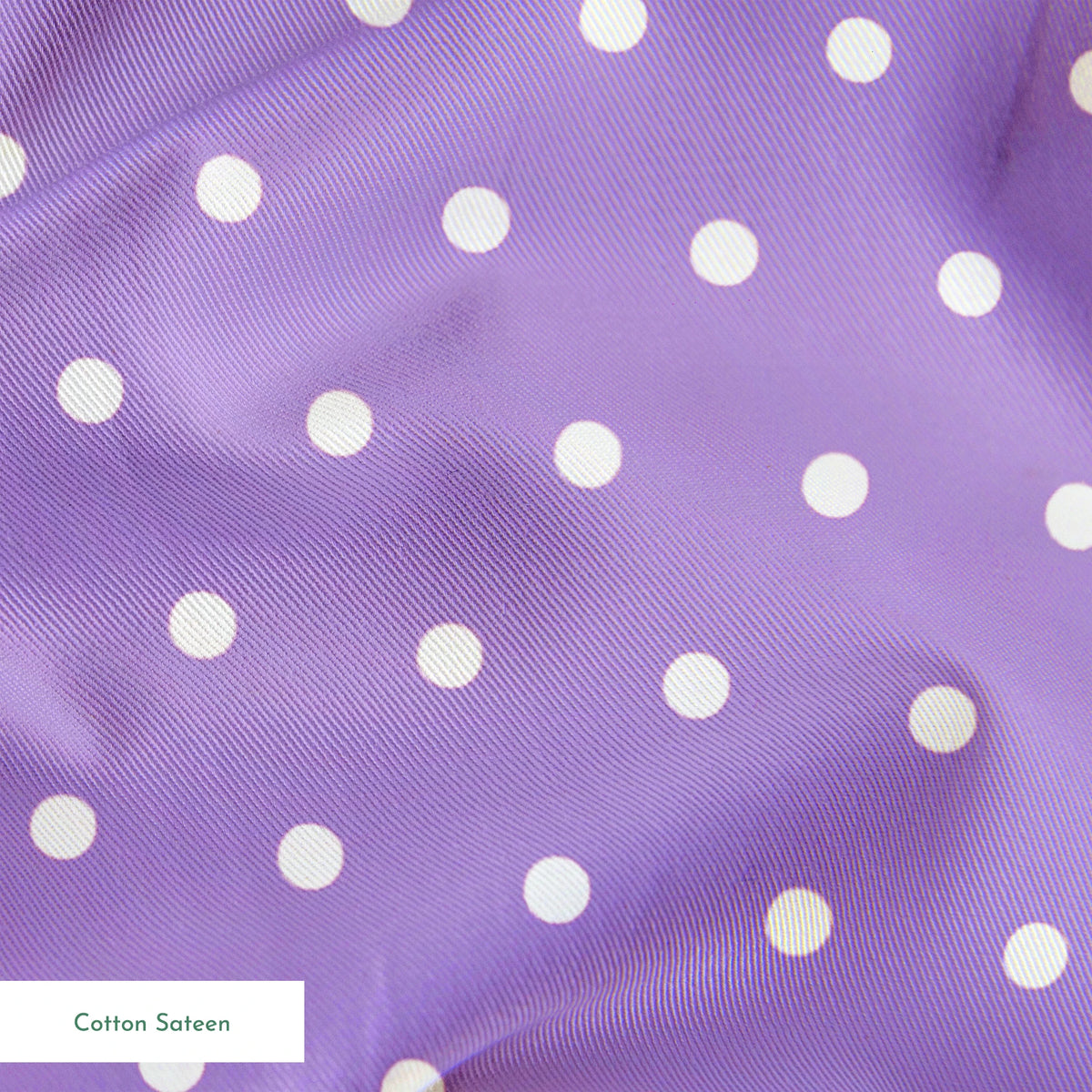 Various white circles on a purple background springs sateen texture