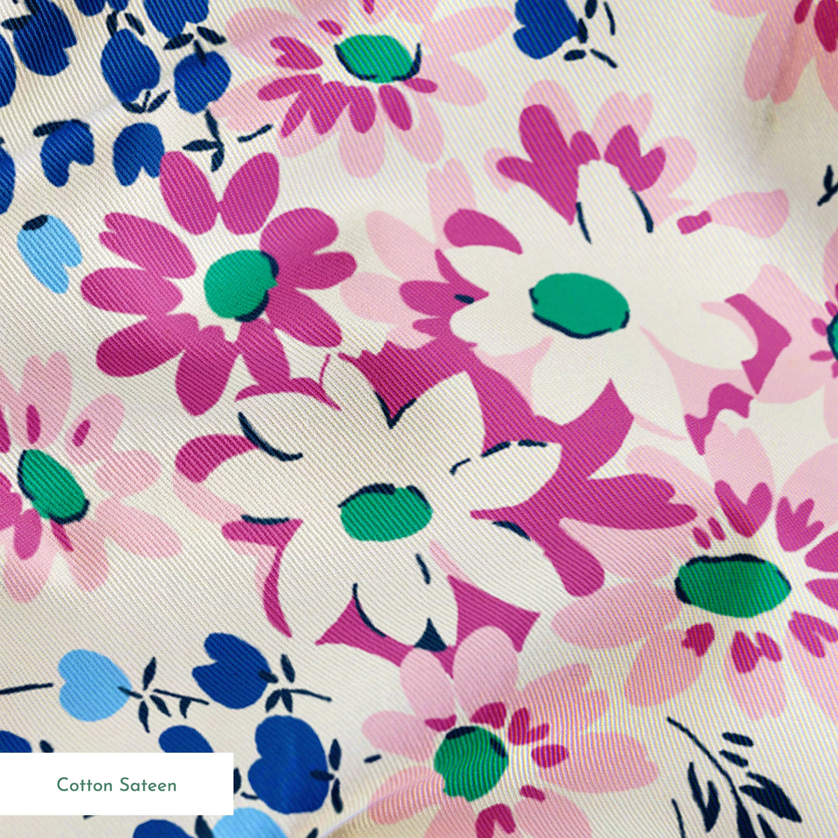 Colorful floral pattern with pink and magenta daisies, blue berries, and green accents on cream background springs sateen texture