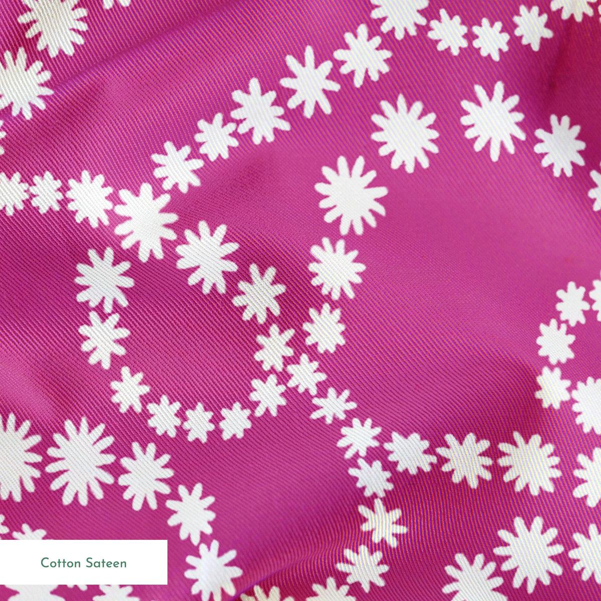 Magenta background with swirling white dotted pattern resembling pearl strands in decorative loops springs sateen texture