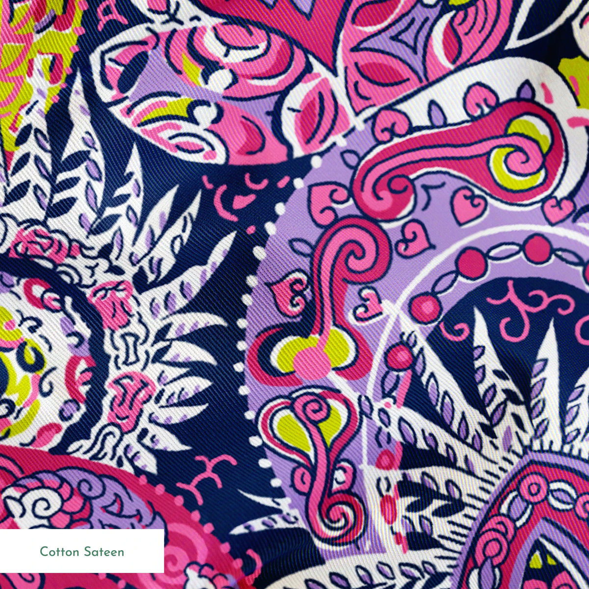 Vibrant paisley pattern in pink, purple, yellow, and blue with intricate swirling designs springs sateen texture