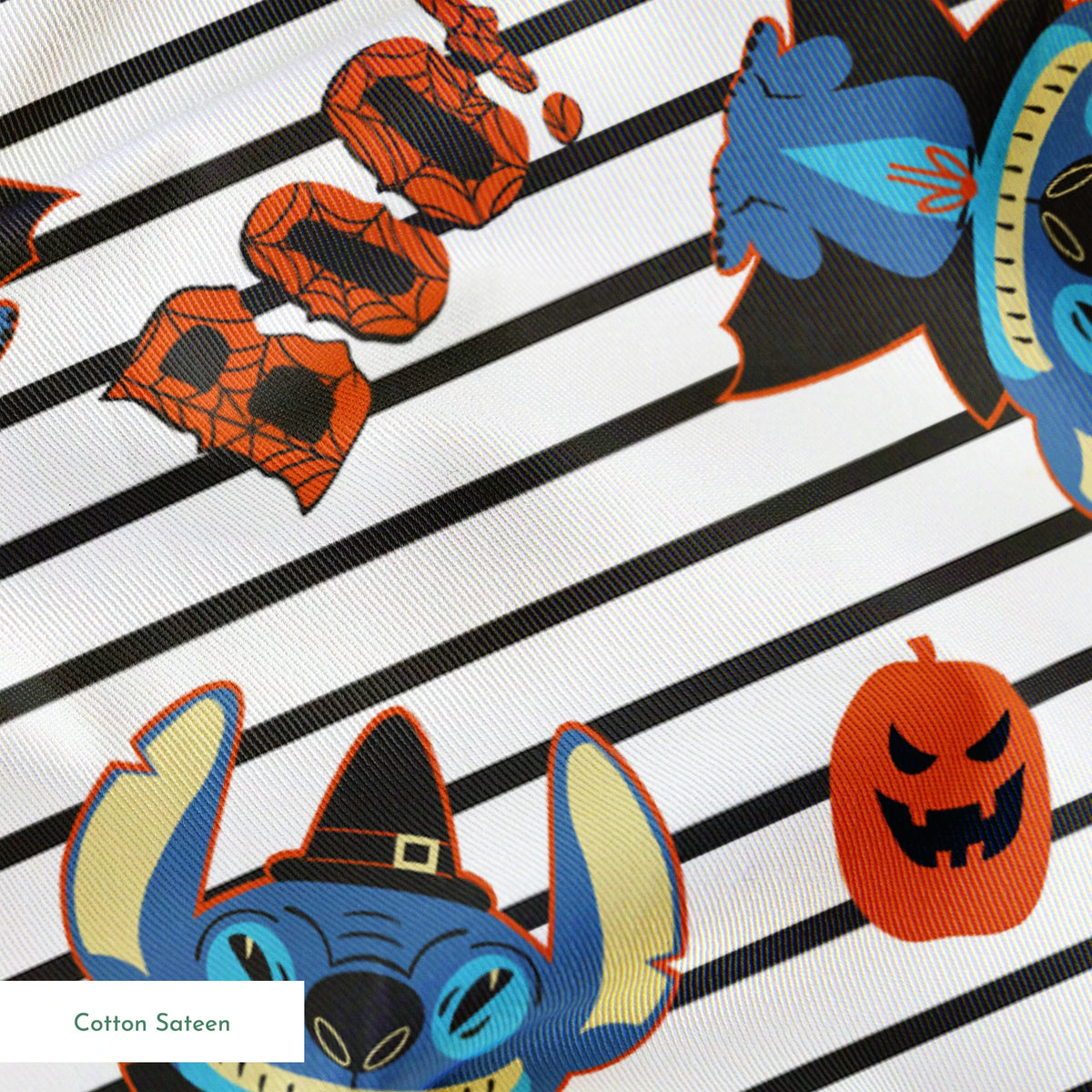 Disney's Stitch with witch hat alongside orange pumpkins on black and white striped background springs sateen texture