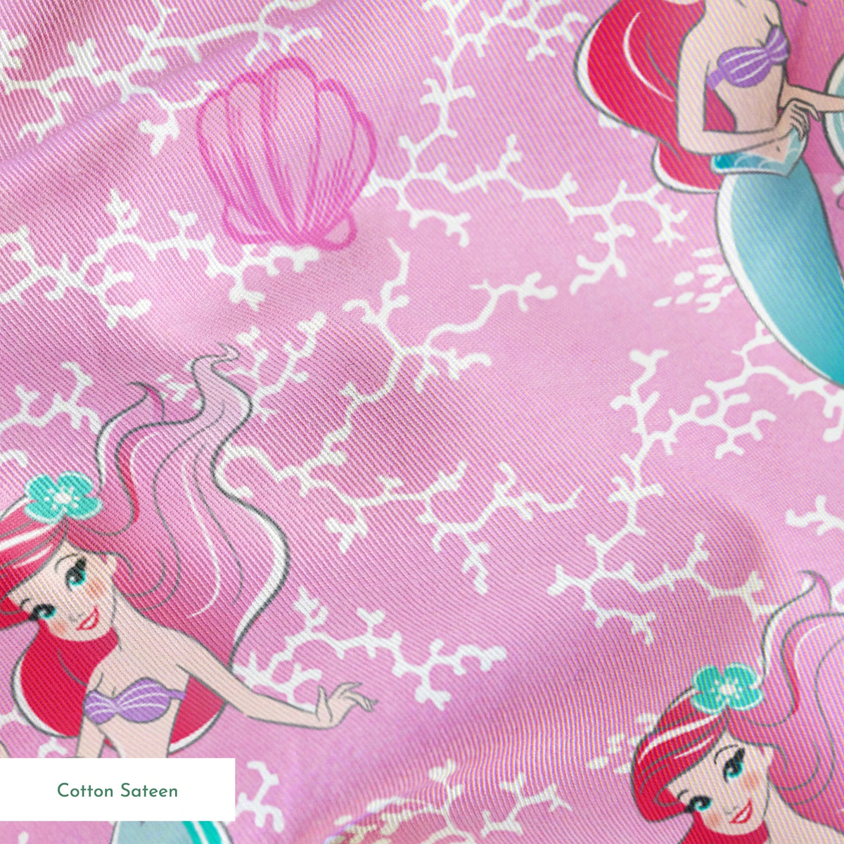 The Little Mermaid pattern with Ariel and purple seashells on pink background with white bubbles springs sateen texture