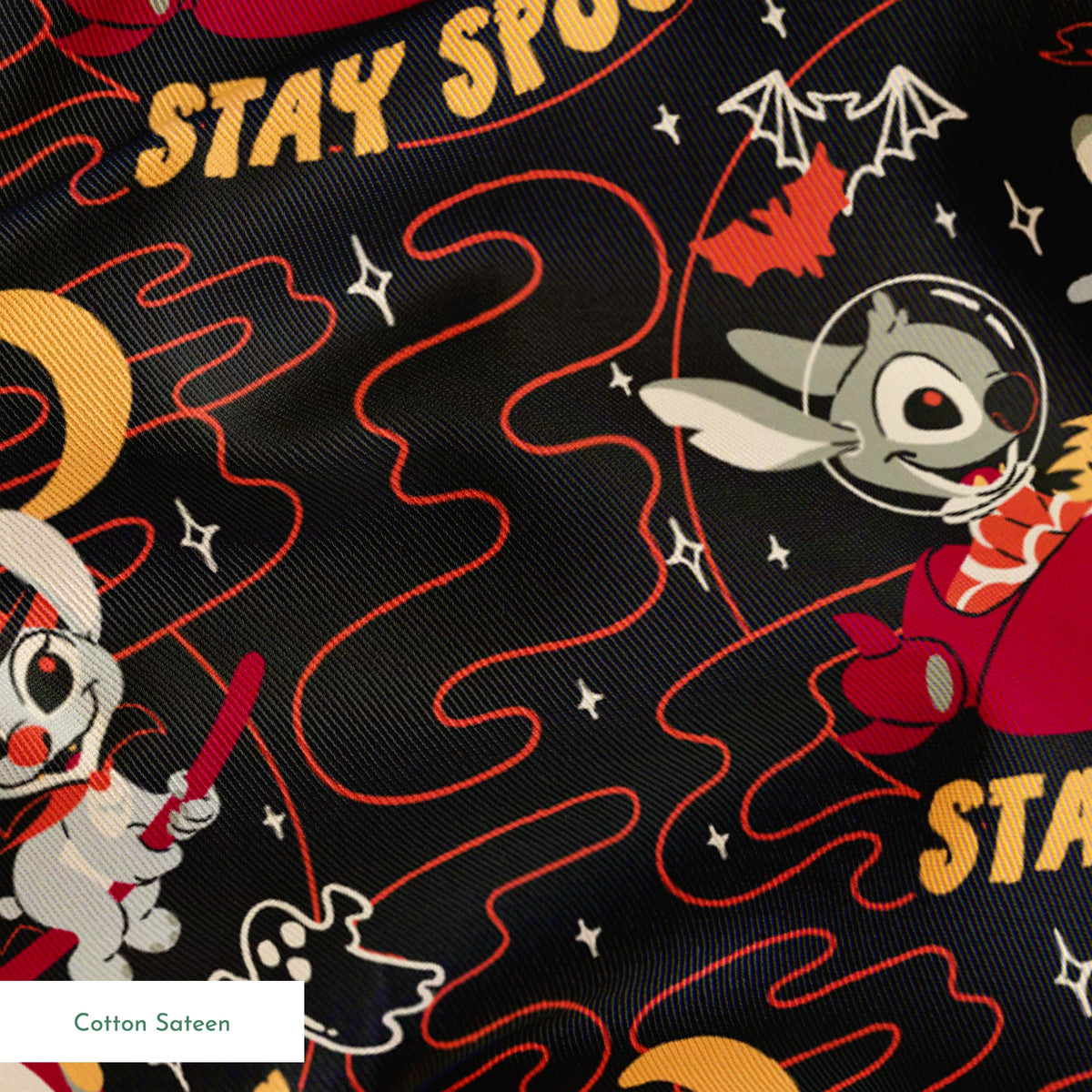 Repeating Halloween pattern with Stitch, "STAY SPOOKY" text, crescent moons, and swirling red lines on dark background. springs sateen texture