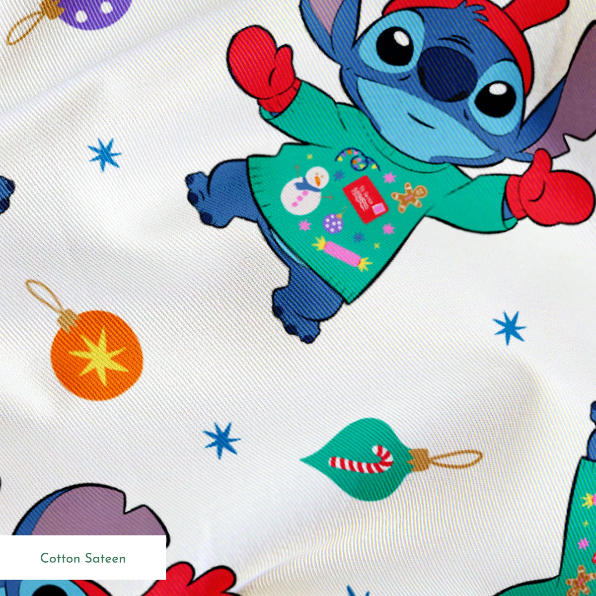 Disney's Stitch wearing green Christmas sweater and red scarf in repeating pattern with ornaments and stars. springs sateen texture