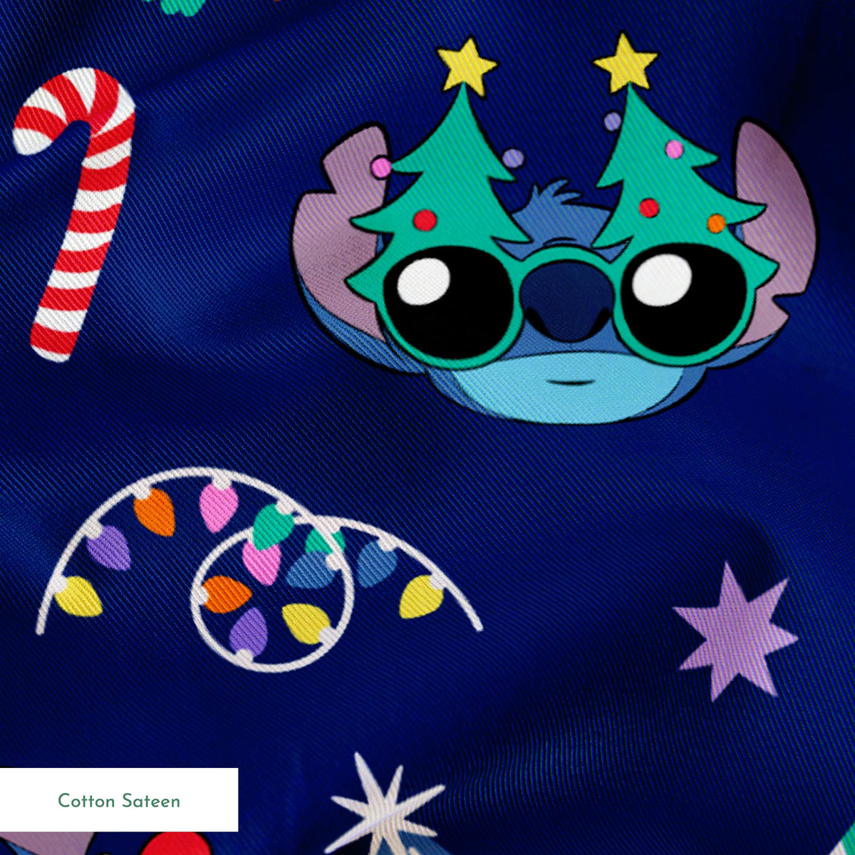 Festive Christmas pattern with Stitch, trees, candy canes, presents, and gingerbread men on navy background springs sateen texture