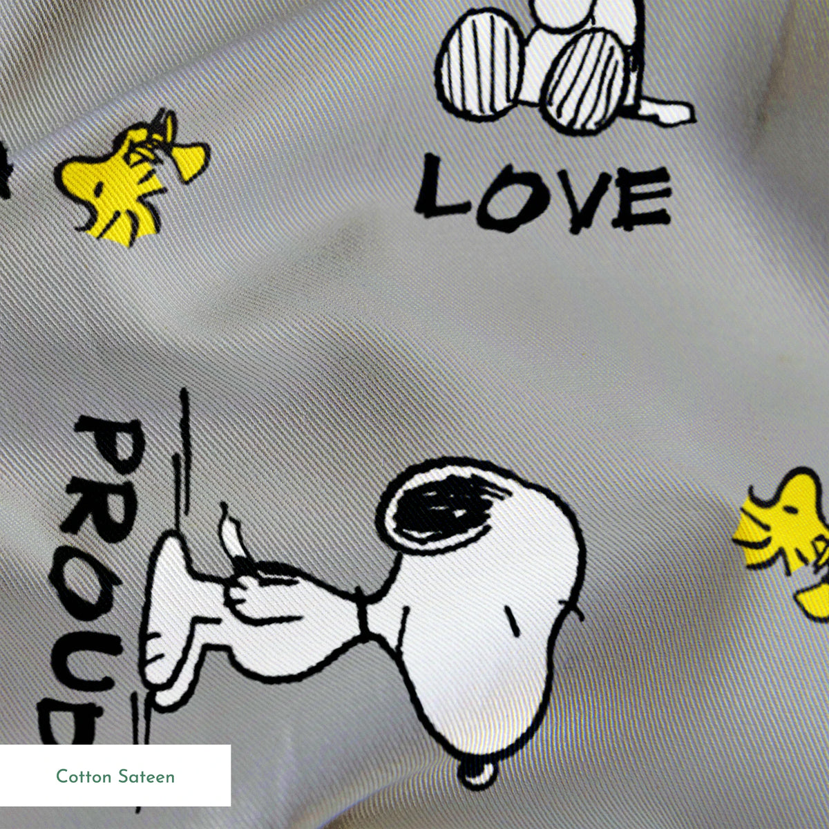 Snoopy cartoon pattern on gray background with emotions like "Hungry" and "Love" with Woodstock springs sateen texture