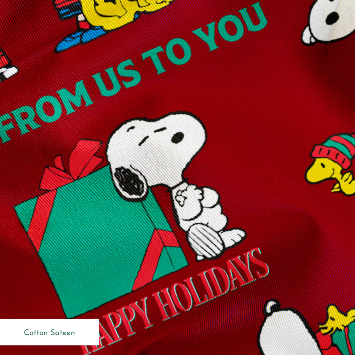 Colorful Peanuts Christmas pattern with Snoopy, Woodstock, and friends with holiday phrases on red background springs sateen texture