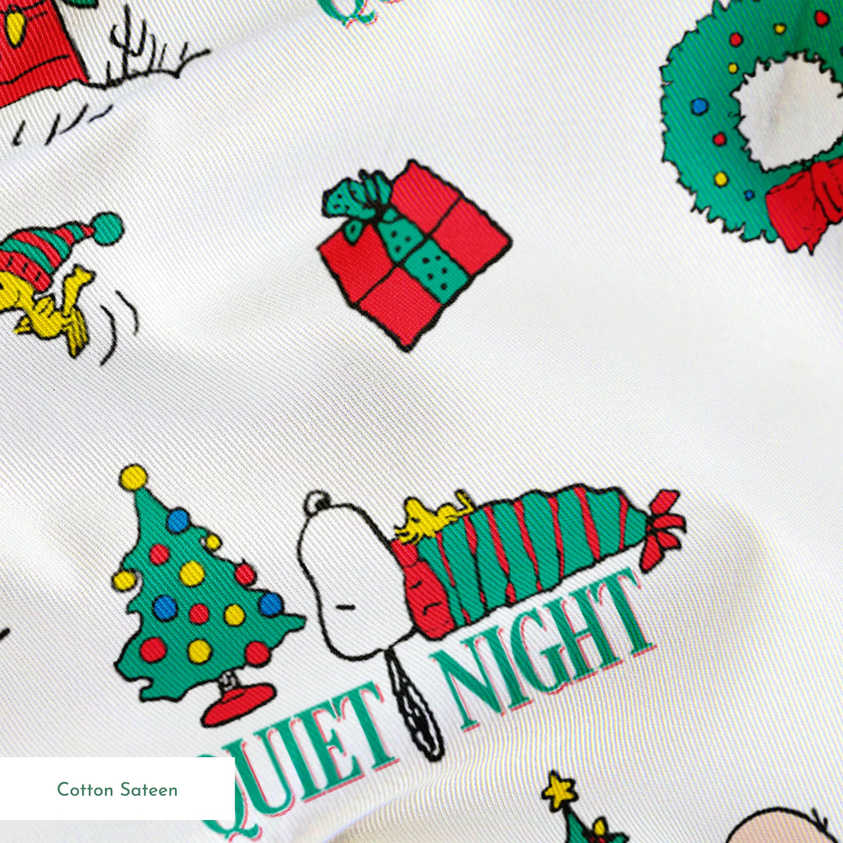 Peanuts Christmas pattern with Snoopy's decorated doghouse, trees, wreaths, and "Quiet Night" text springs sateen texture