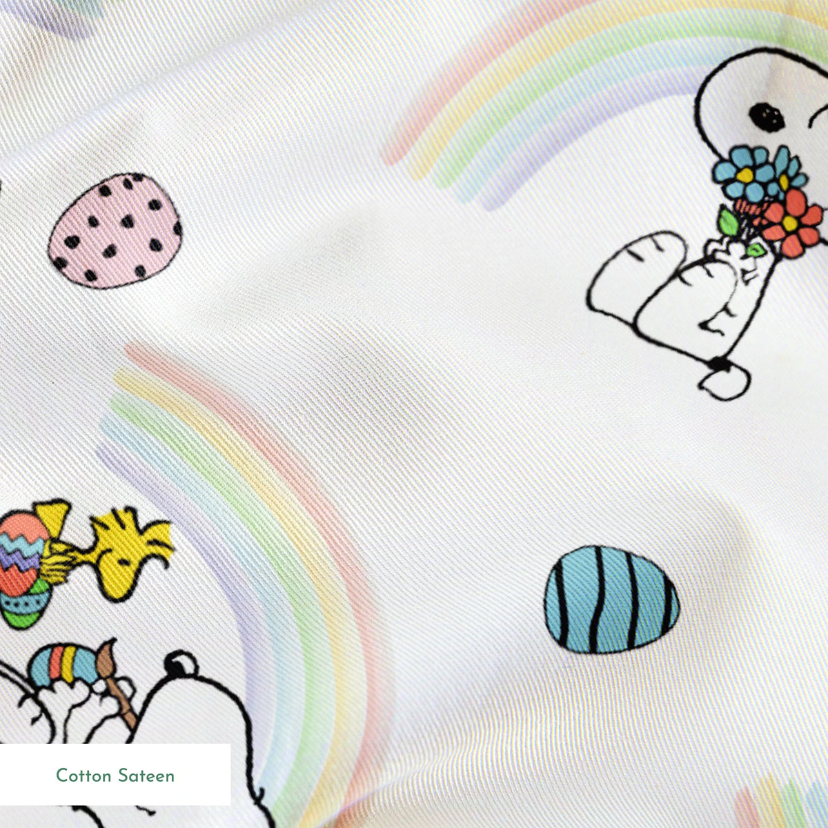 Snoopy pattern with Easter eggs, rainbows, and Woodstock, featuring Snoopy holding flowers and baskets springs sateen texture