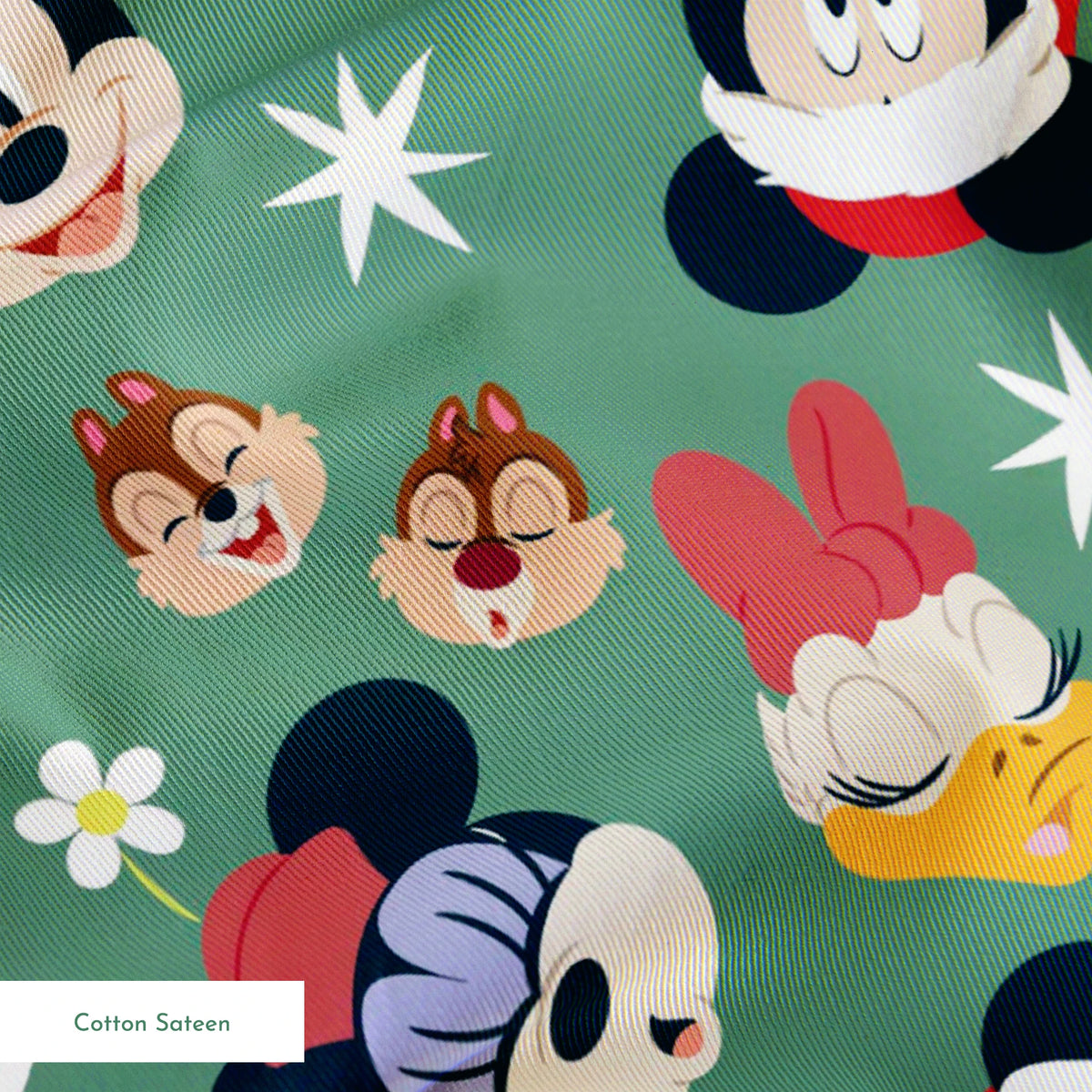 Mickey Mouse holiday pattern with characters wearing Santa hats on green background with stars and ornaments springs sateen texture