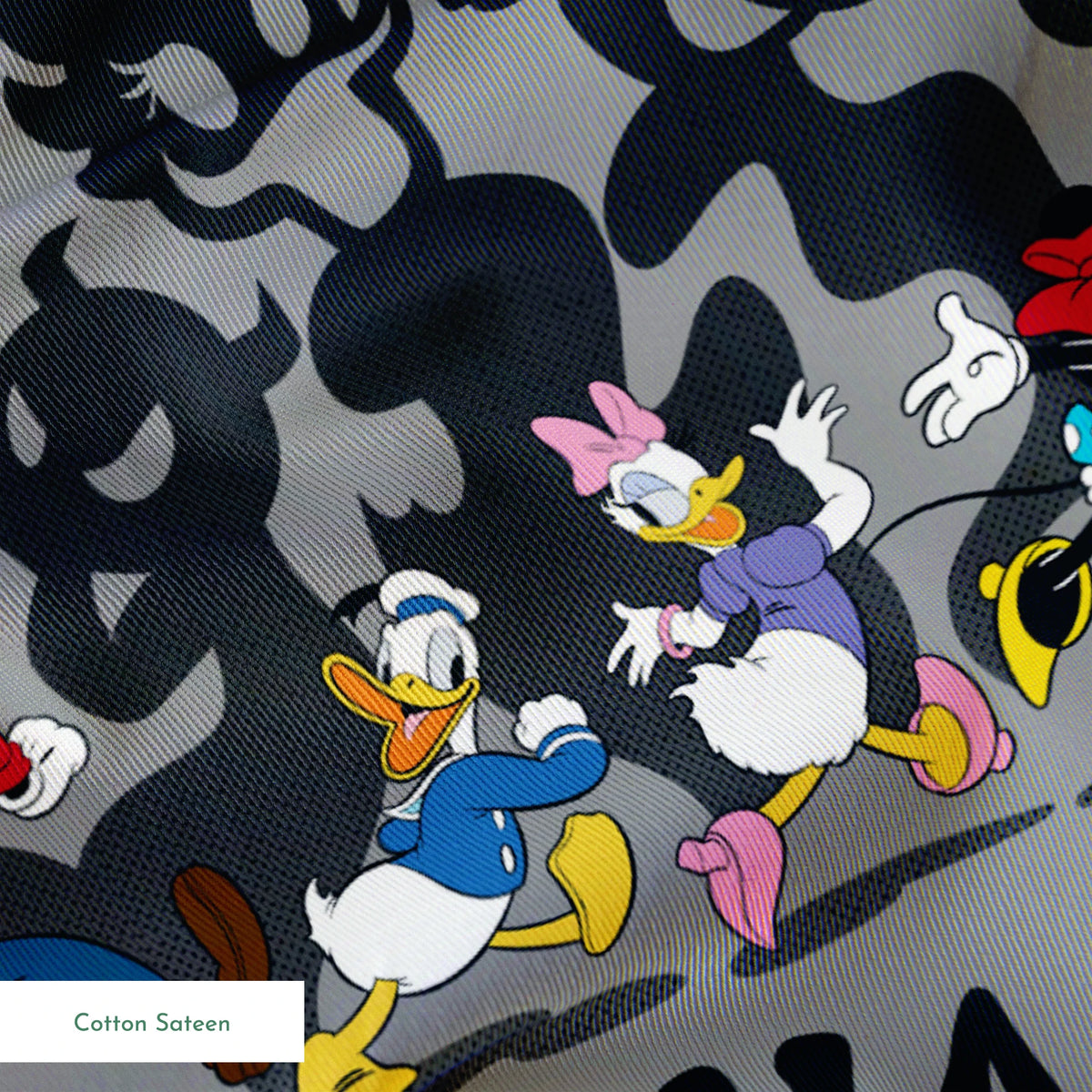 Classic Disney characters on dark gray background with "Happy Haunting" text, Mickey, Donald, and friends in Halloween-themed poses. springs sateen texture