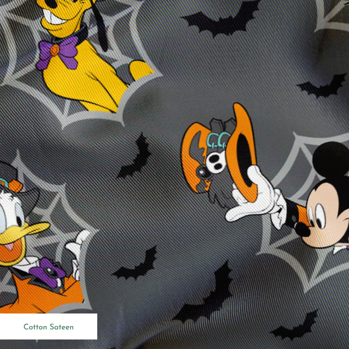 Disney cartoon characters in Halloween costumes on gray background with spider webs and bats springs sateen texture